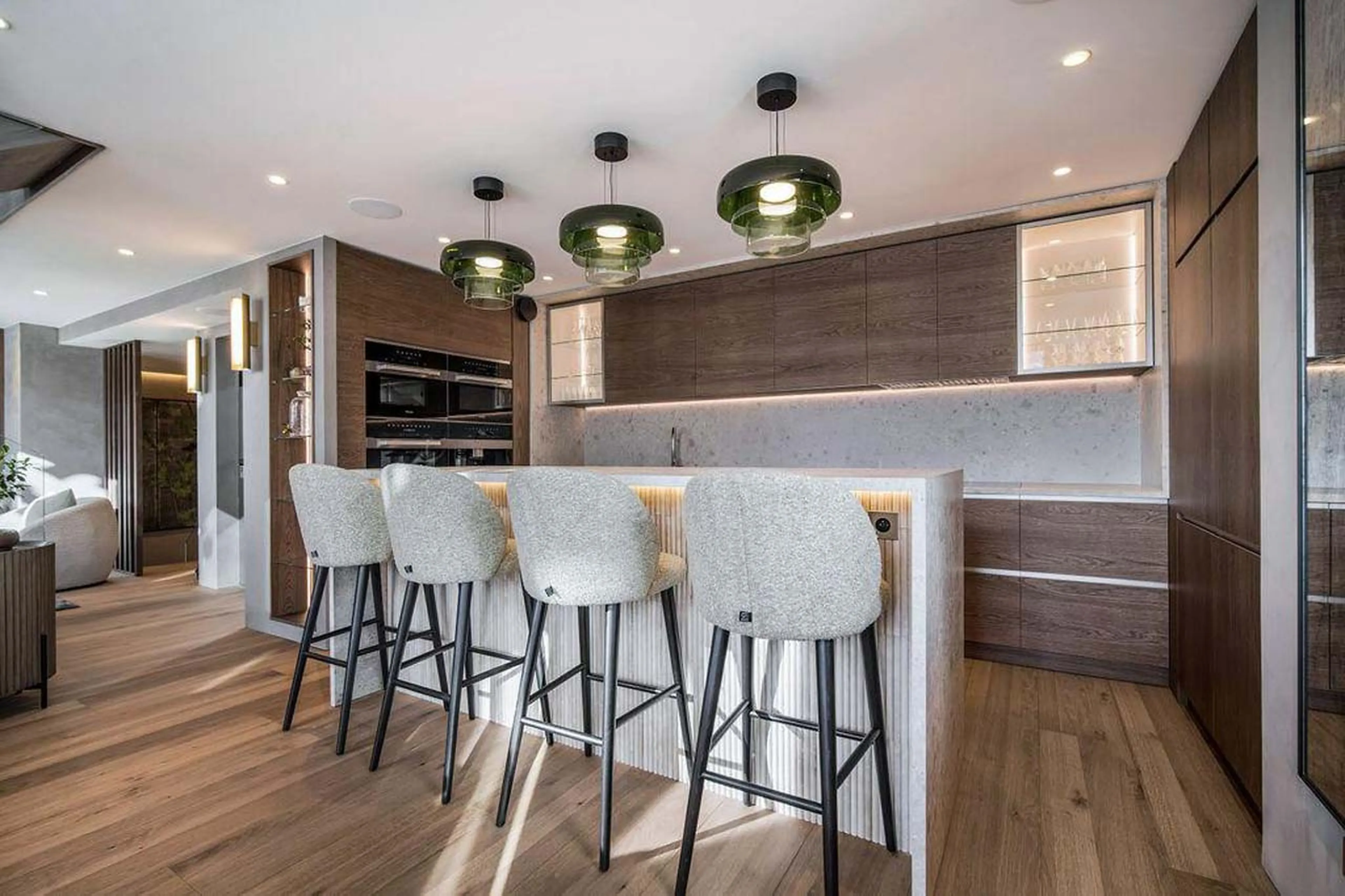 Kitchen with high seating at island in Chalet Escapade, St Martin de Belleville