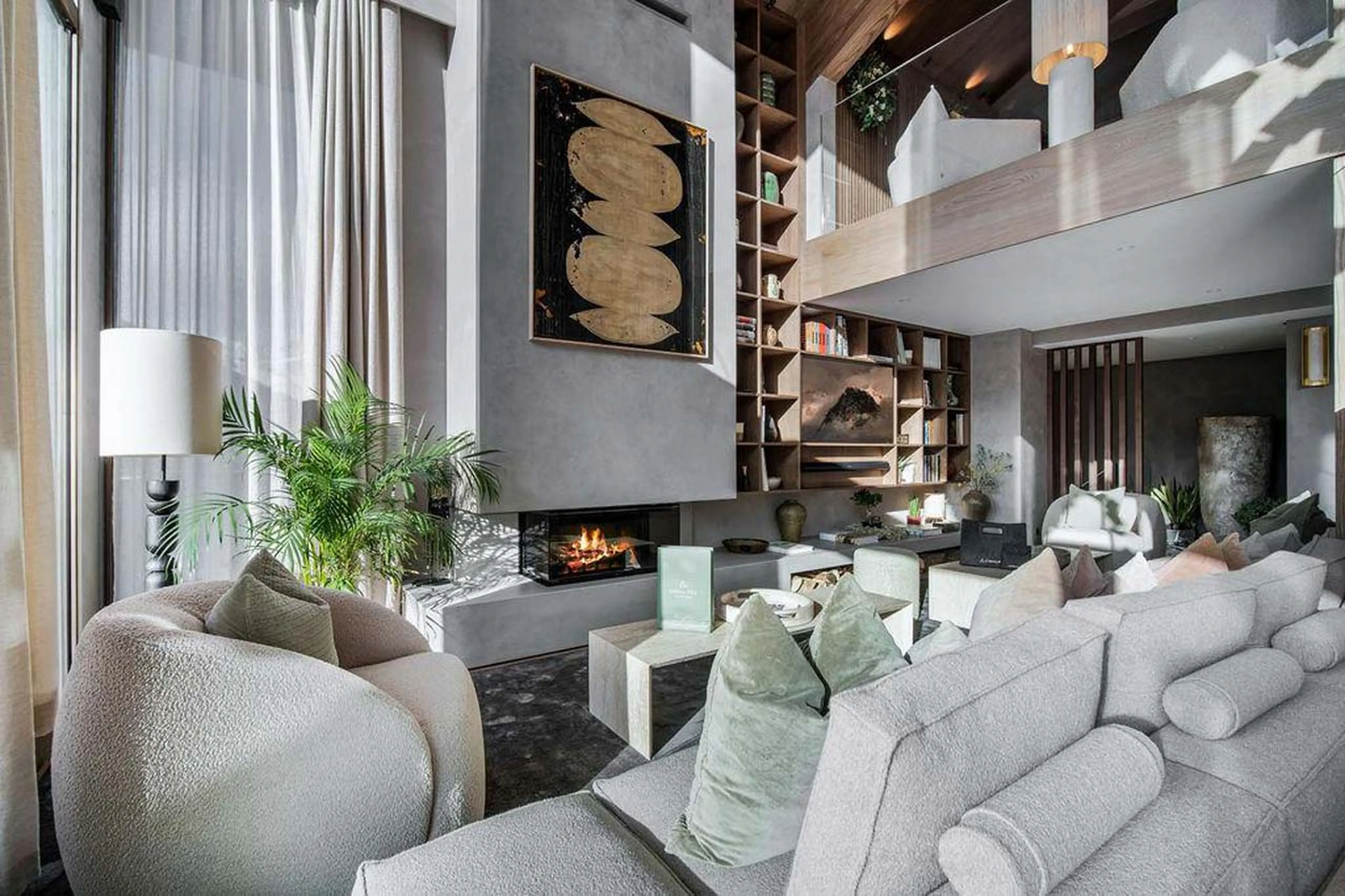 Sofas and armchairs in front of fireplace in Chalet Escapade, St Martin de Belleville