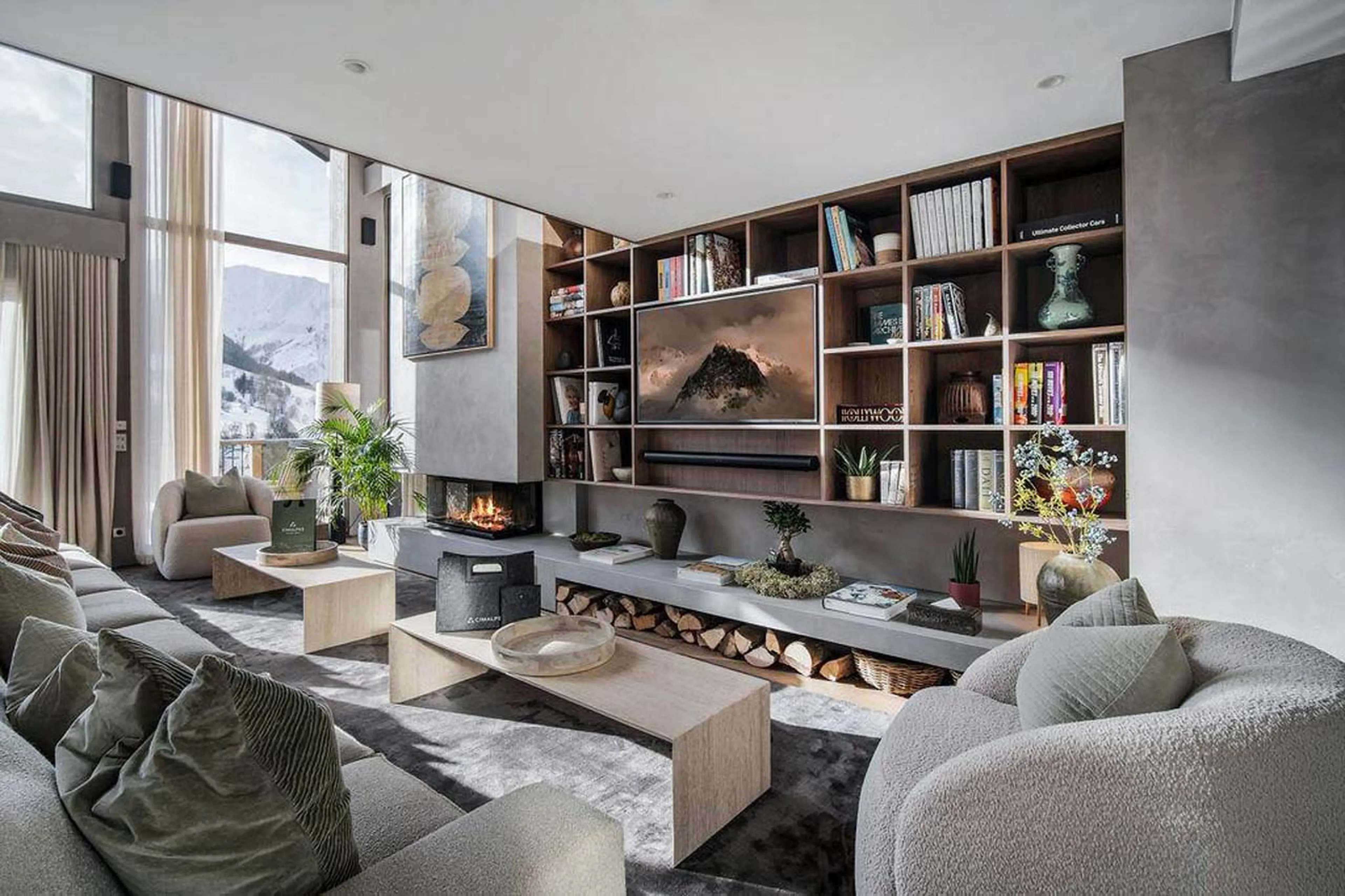 Comfortable sofas in front of fireplace in Chalet Escapade, St Martin de Belleville