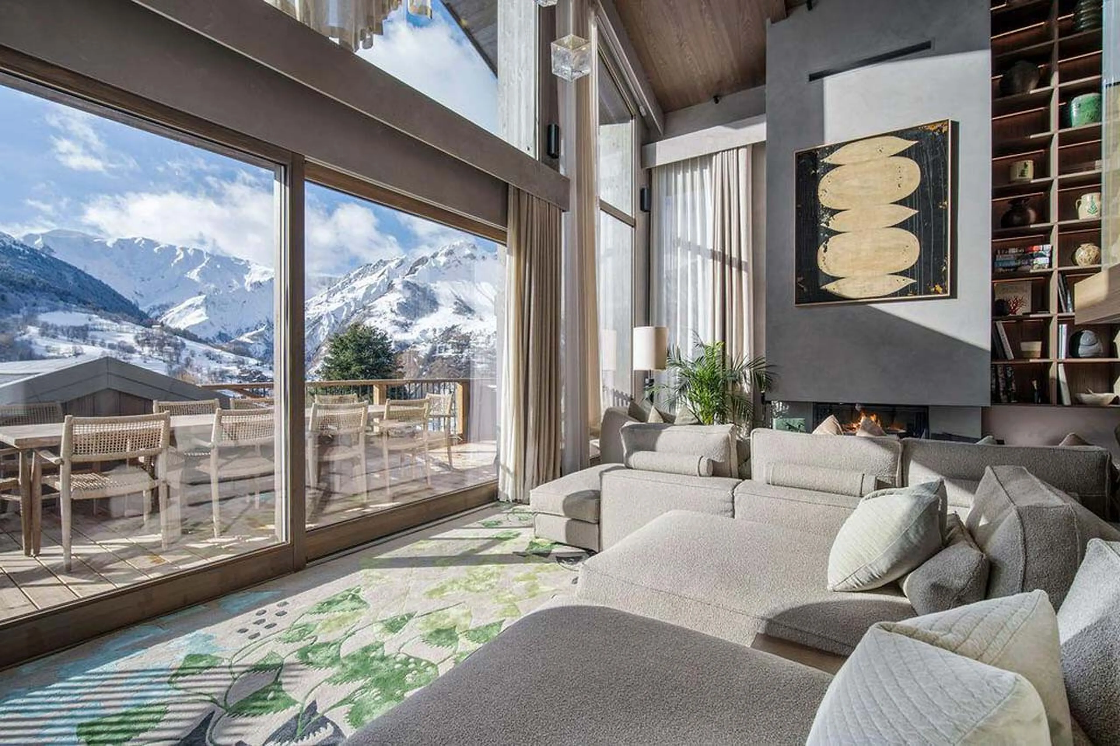 Sofa facing expansive windows in Chalet Escapade, St Martin de Belleville