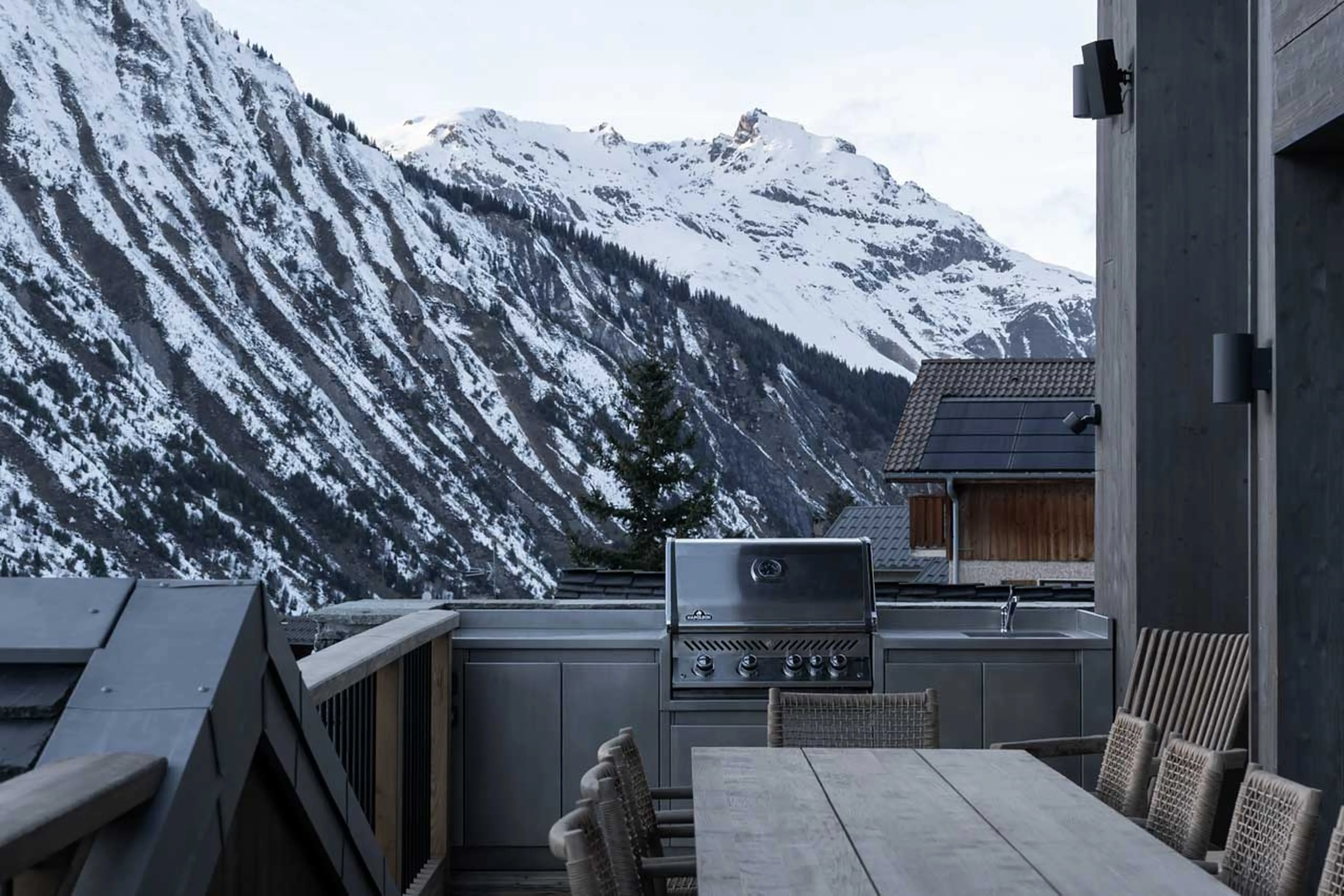 Balcony with table at Chalet Escapade, St Martin de Belleville