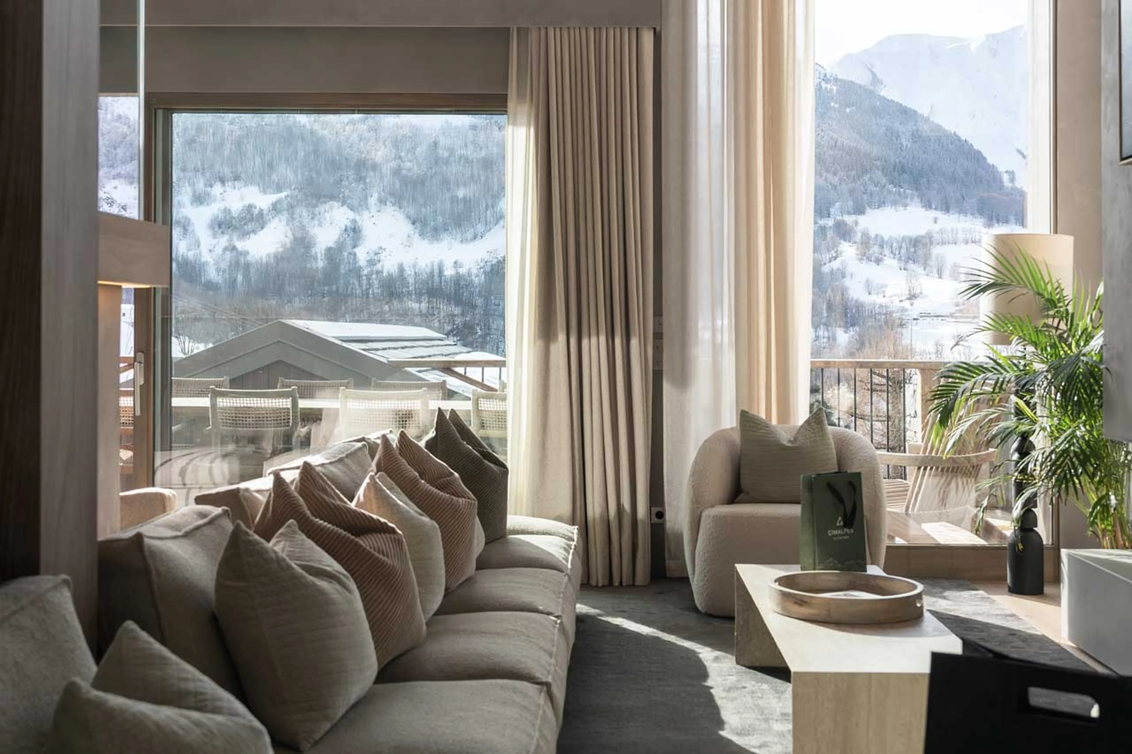 Comfortable sofas in front of fireplace in Chalet Escapade, St Martin de Belleville