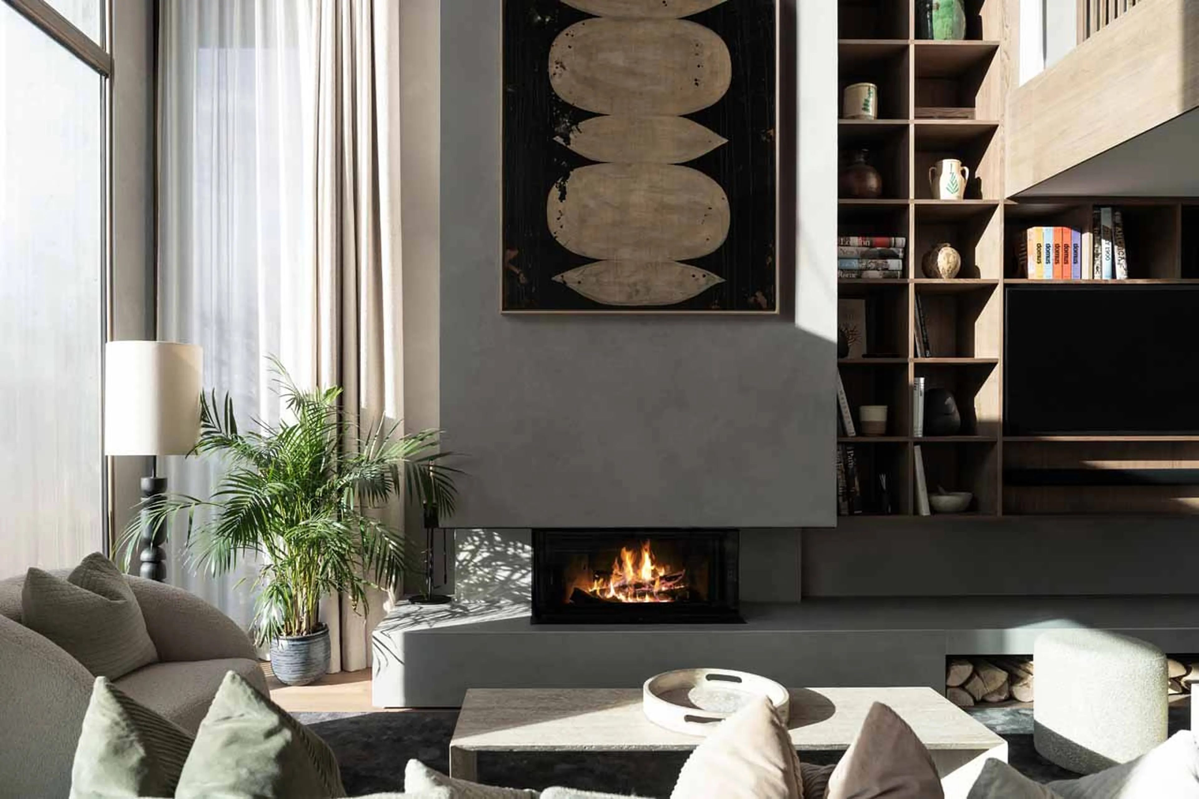 Sofas and armchairs in front of fireplace in Chalet Escapade, St Martin de Belleville