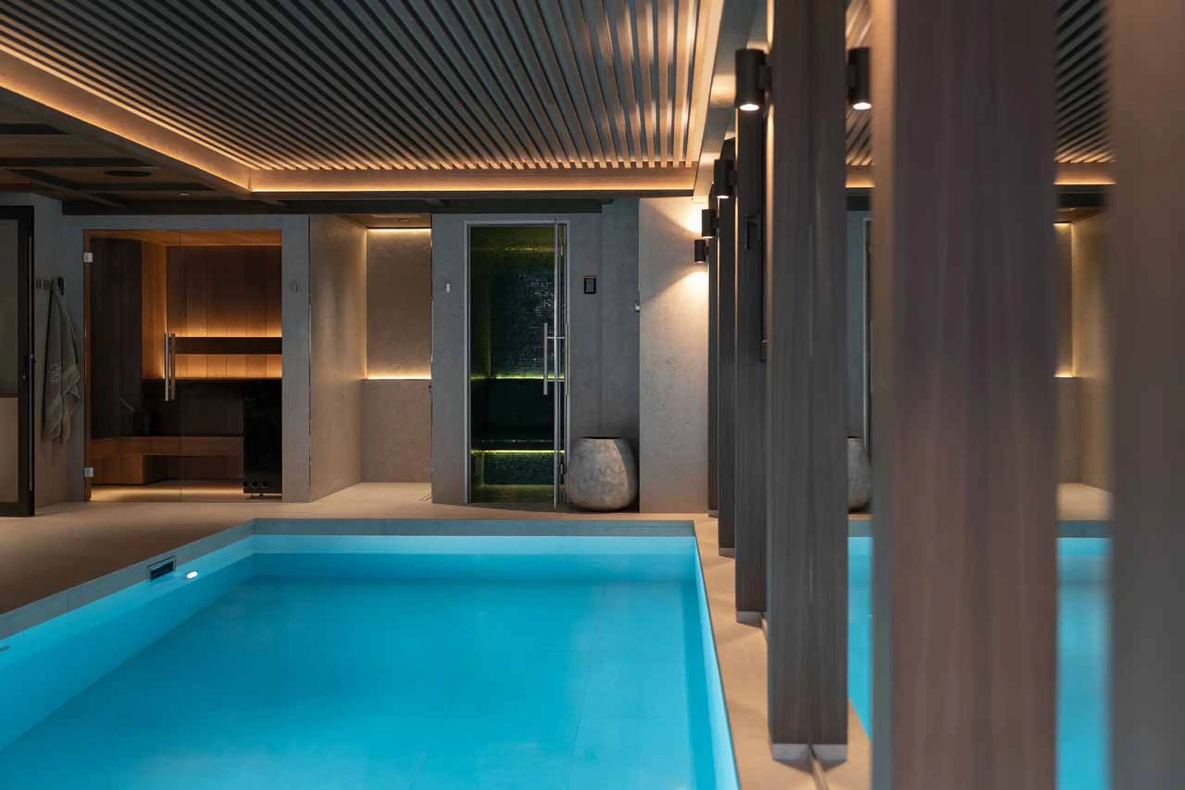Loungers in front of swimming pool in Chalet Escapade, St Martin de Belleville