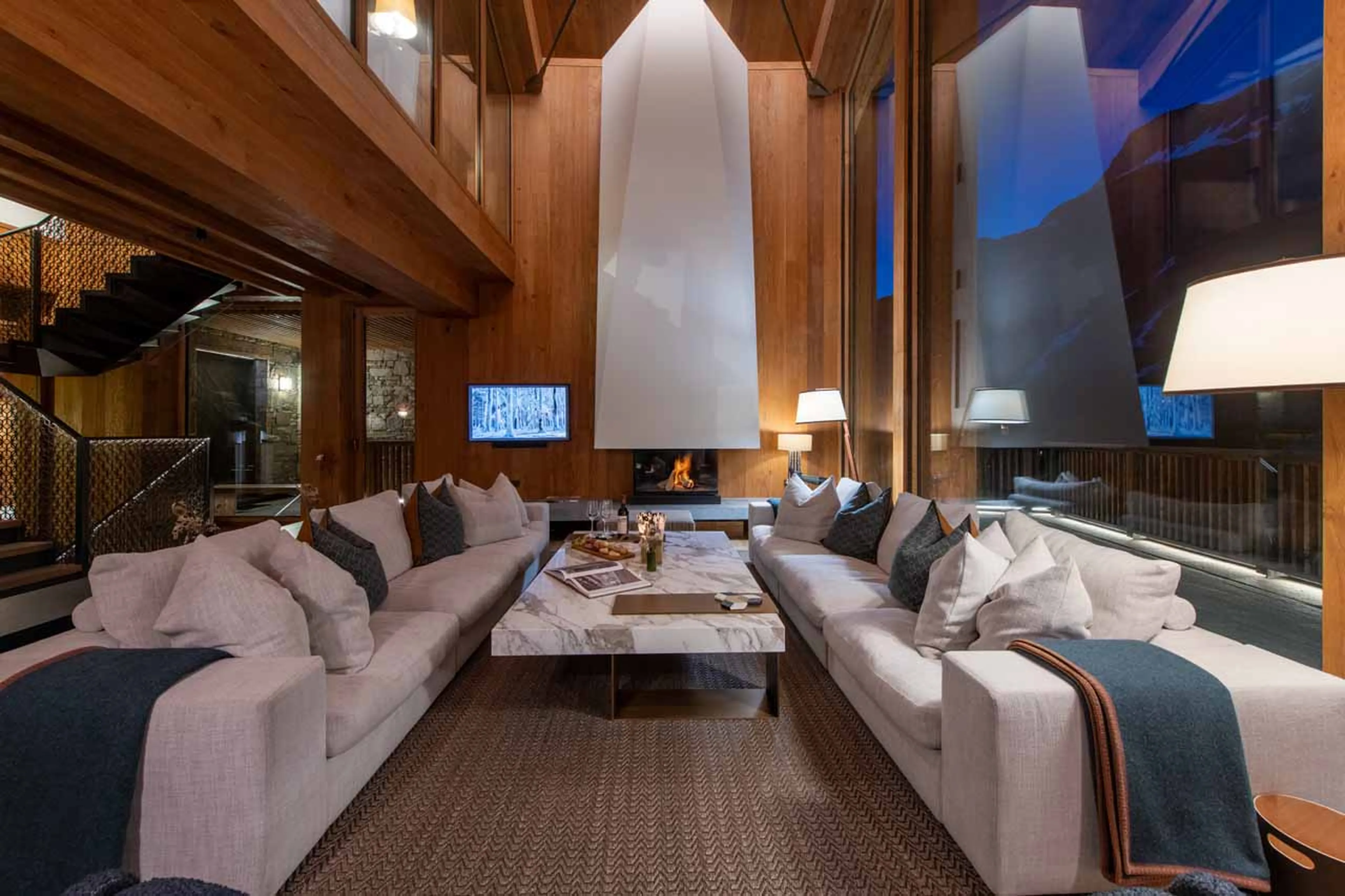 Fireplace & TV in living area at Chalet Etoile du Nord - East Wing in Val d'Isere