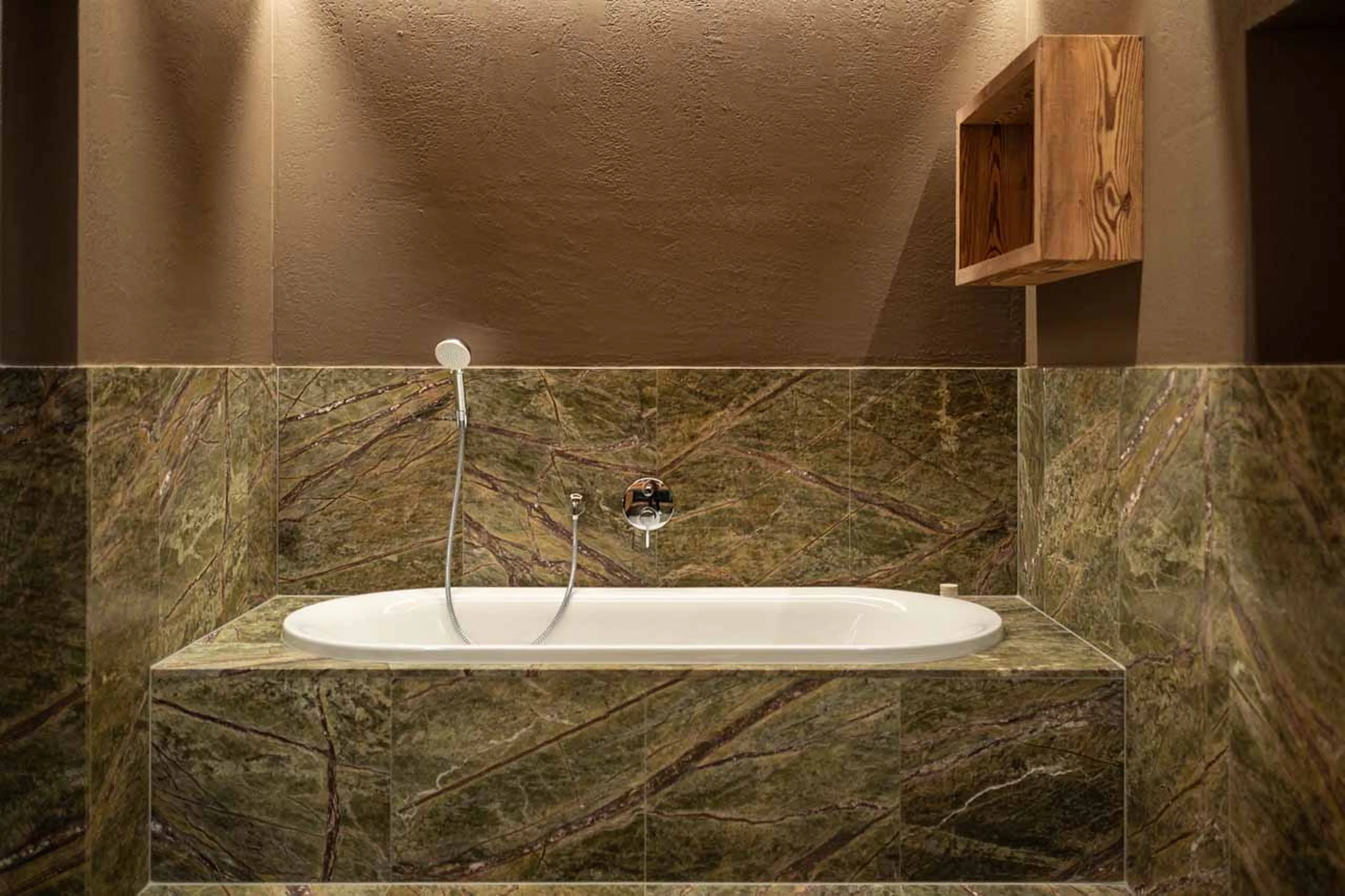 Bathtub in bathroom one at Chalet Falcon in Lech