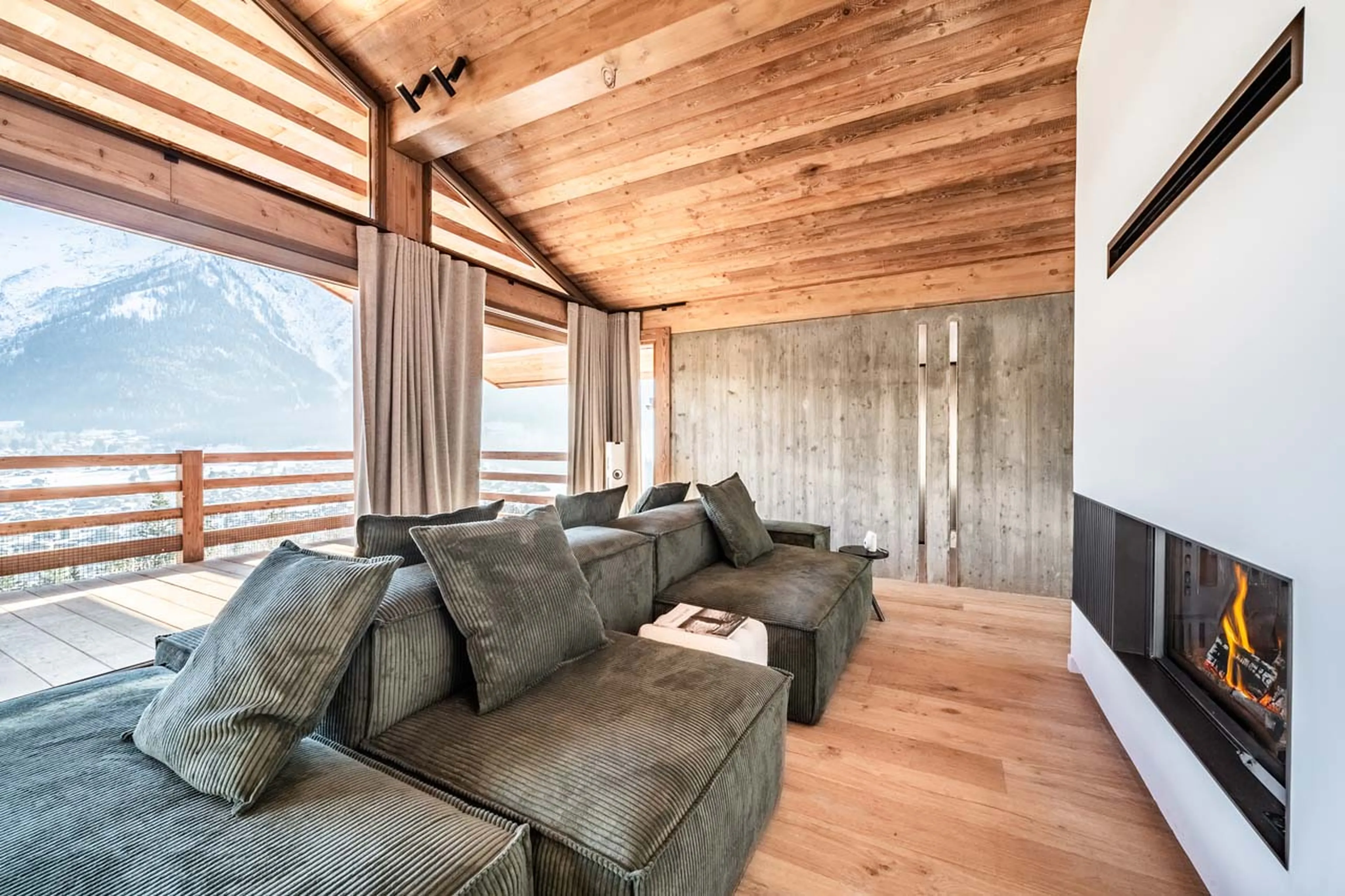 Sofas and fireplace in living area of Chalet Foxden in Chamonix