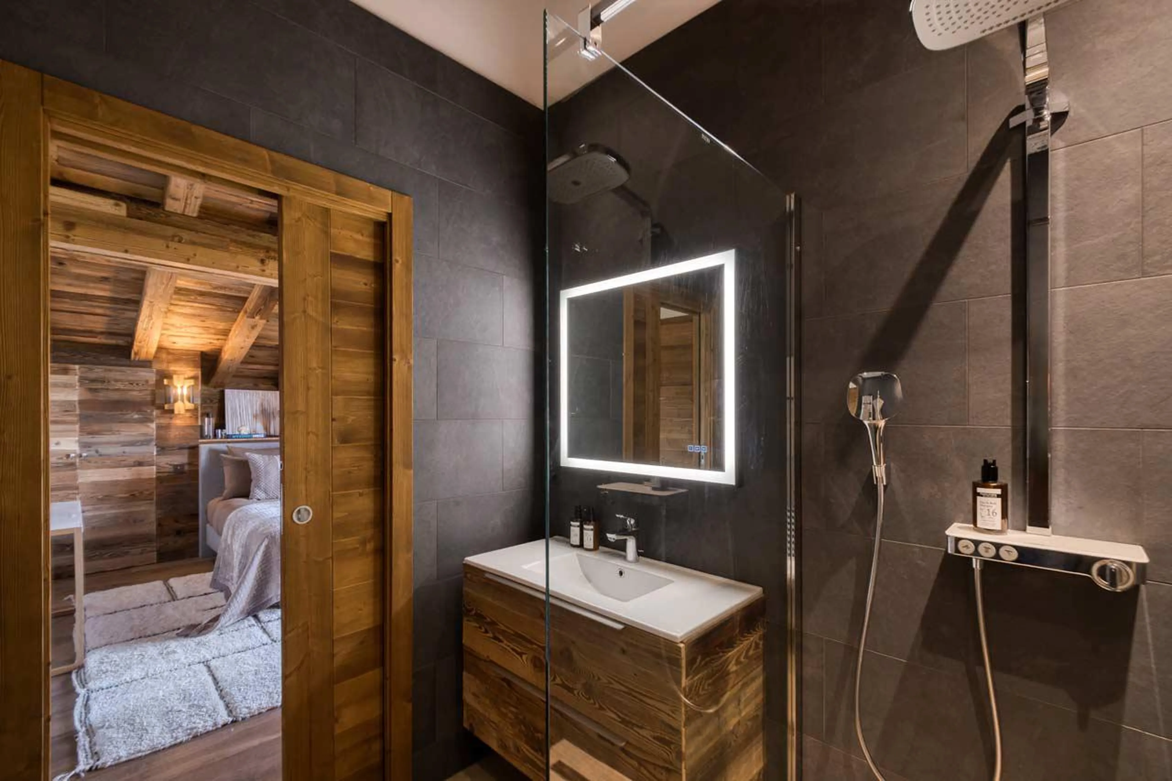 En-suite bathroom with shower at Chalet Gaia in Megeve