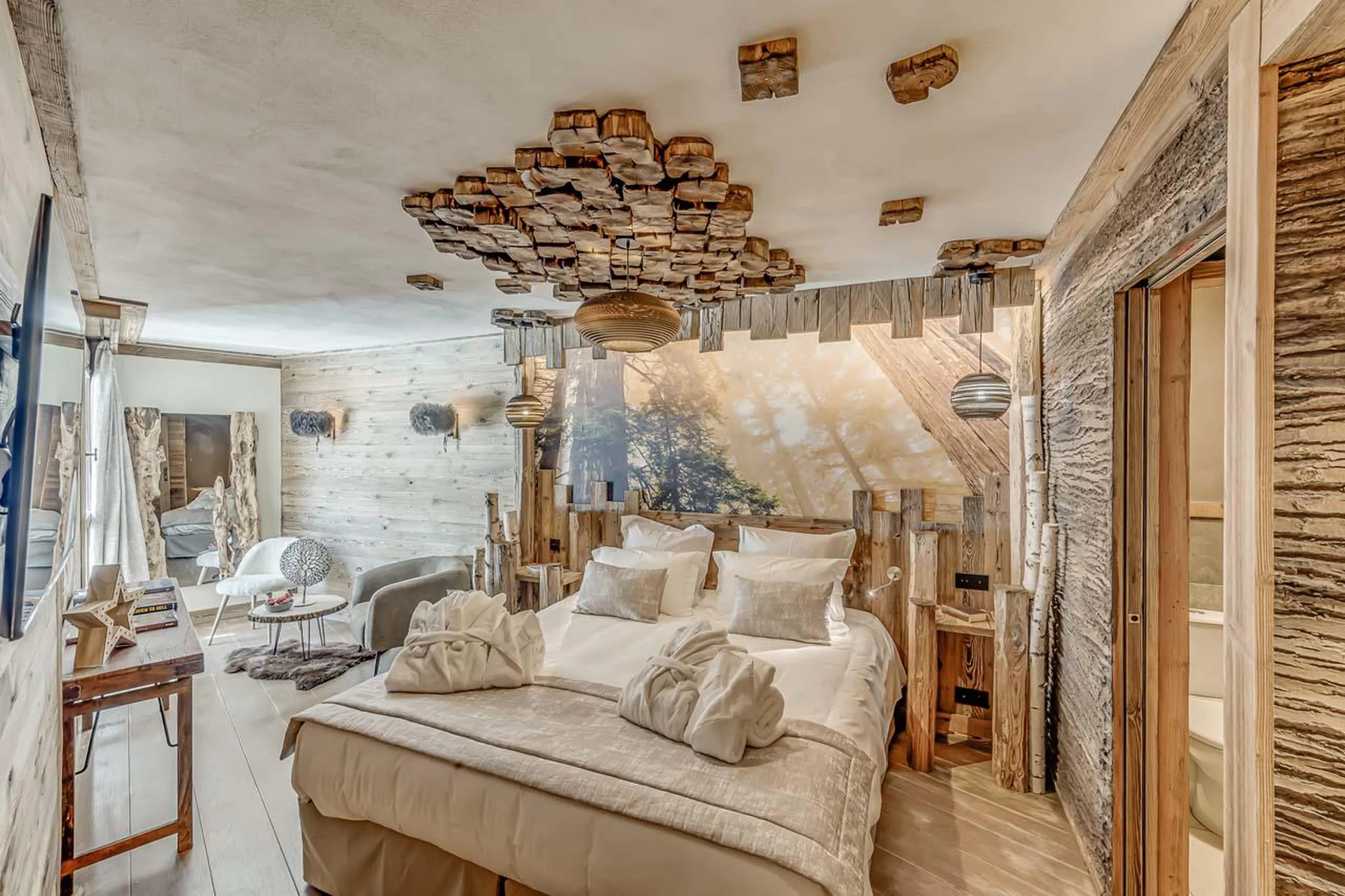 Double master bedroom with wardrobe, work desk and sofa at Chalet Ganga in Tignes