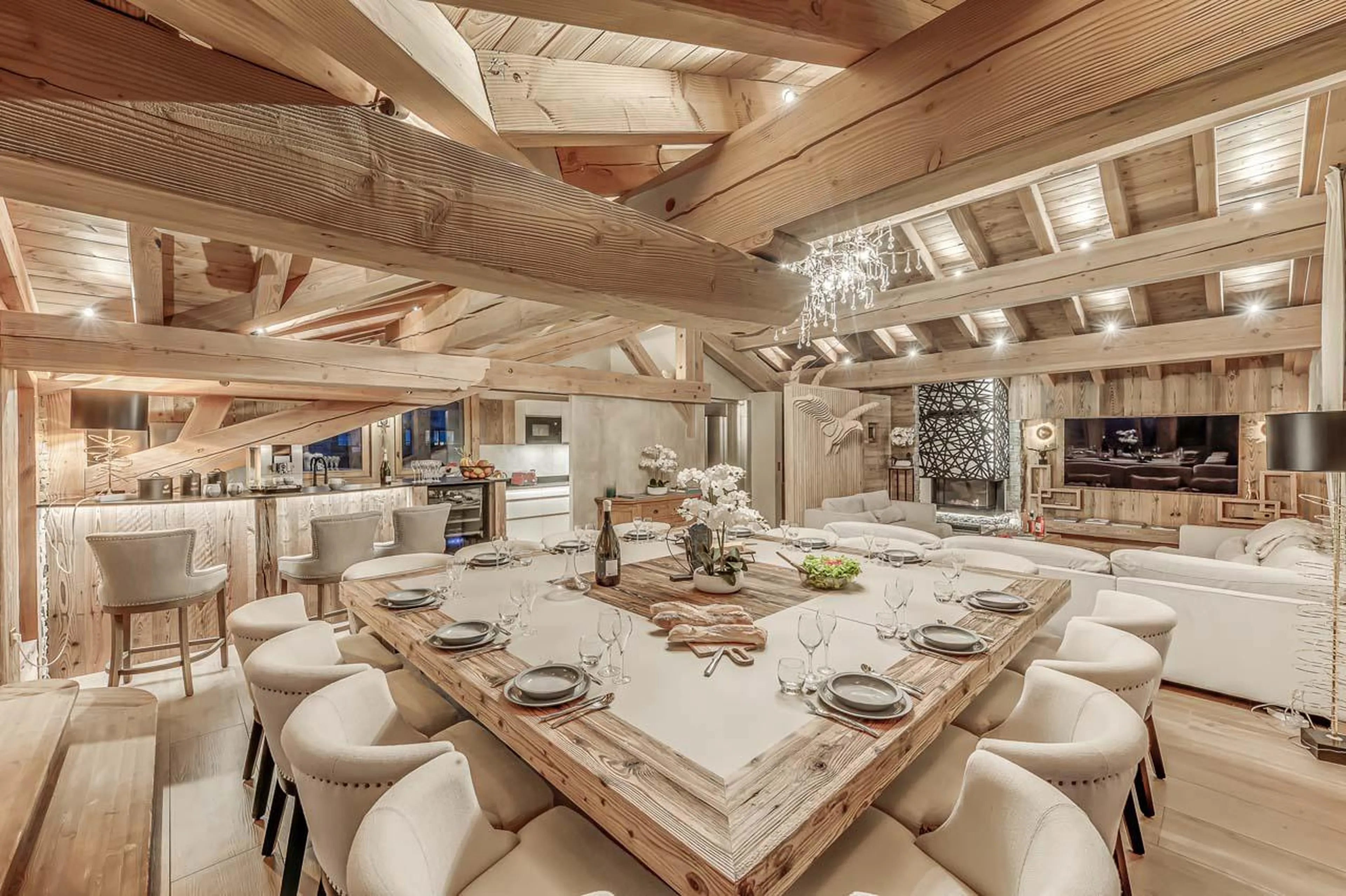 Dining space overlooking modern living area at Chalet Ganga in Tignes
