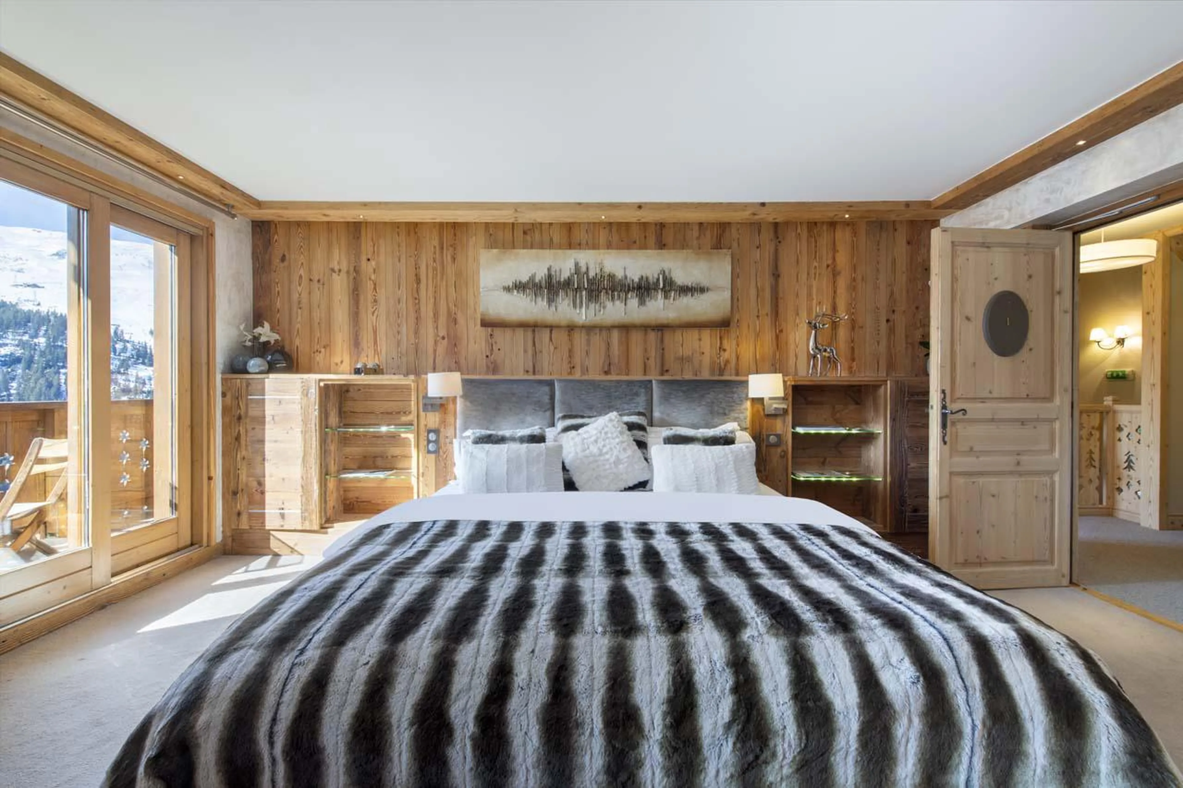Master bedroom with modern chalet feel at Chalet Genepi in Meribel