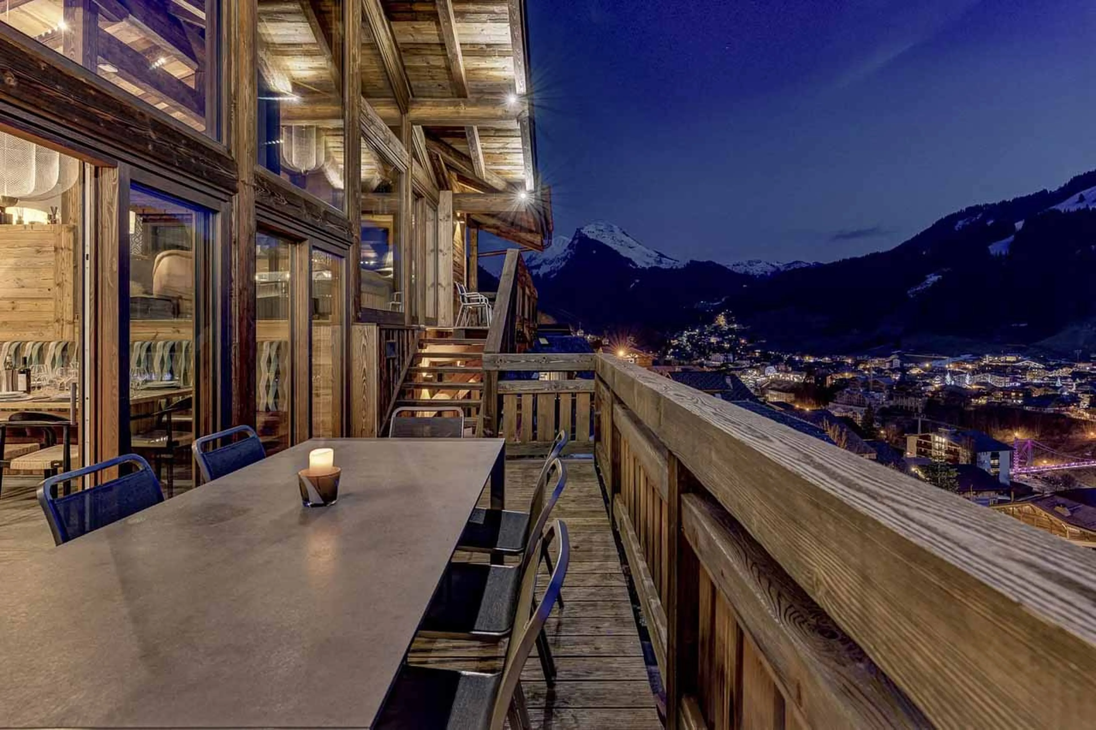 Wrap-around balcony with dining table at Chalet Goldilocks & Three Bears in Morzine