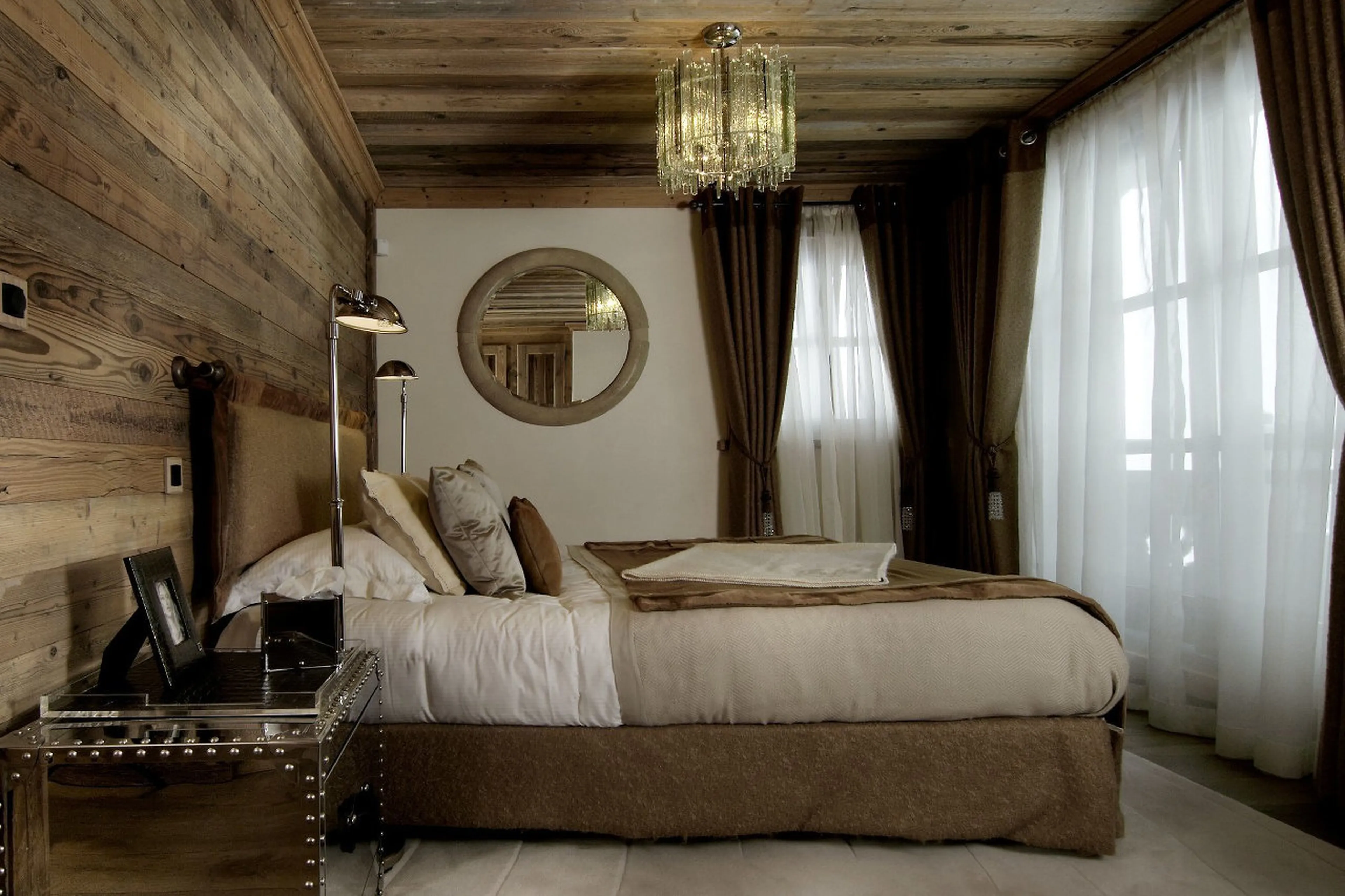 En suite double bedroom with balcony access in Chalet La Grande Roche in Courchevel 1850