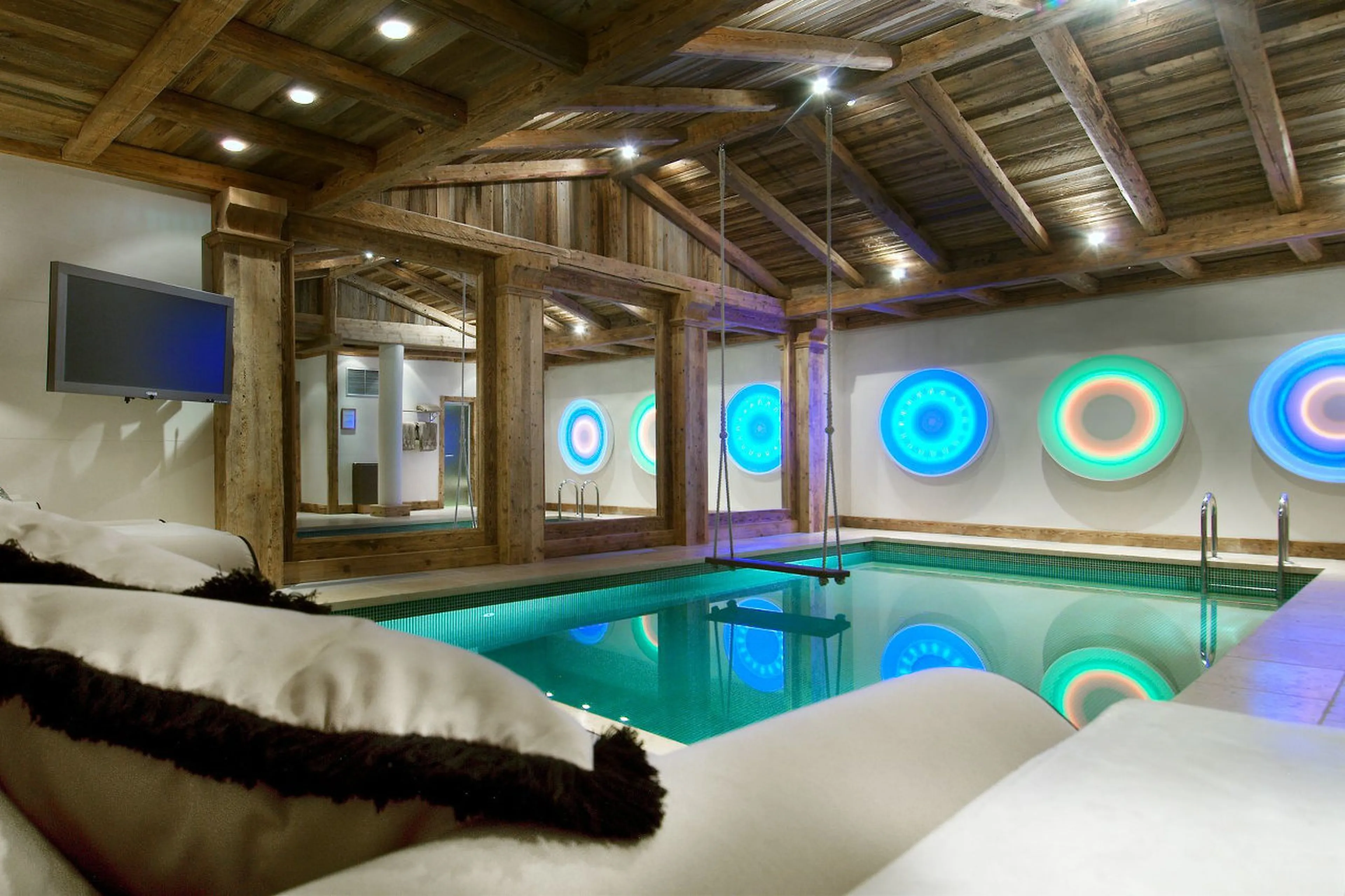 Luxury sofas next to the pool in Chalet La Grande Roche in Courchevel 1850