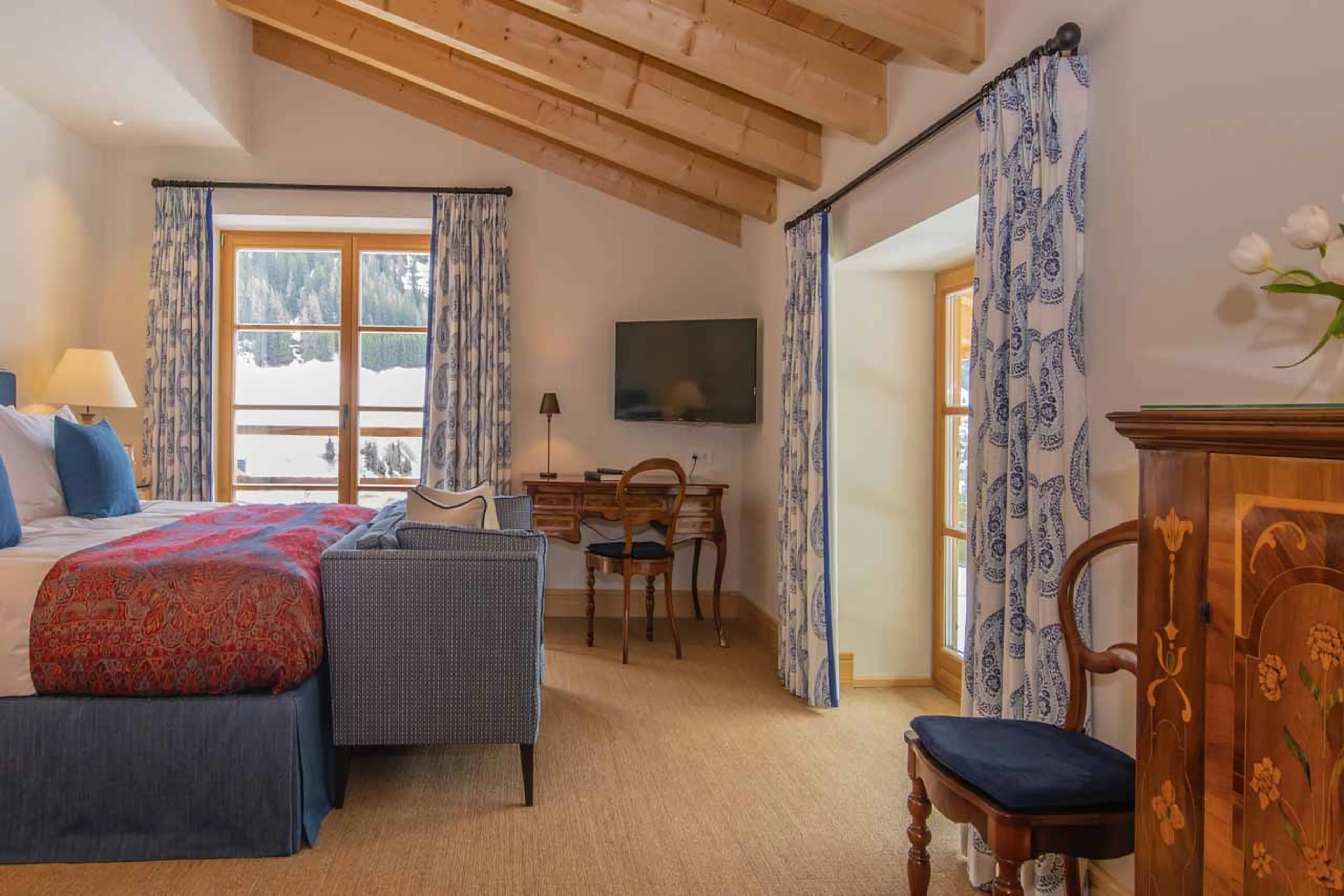 Tv & desk in bedroom at Chalet Griffin in St Anton