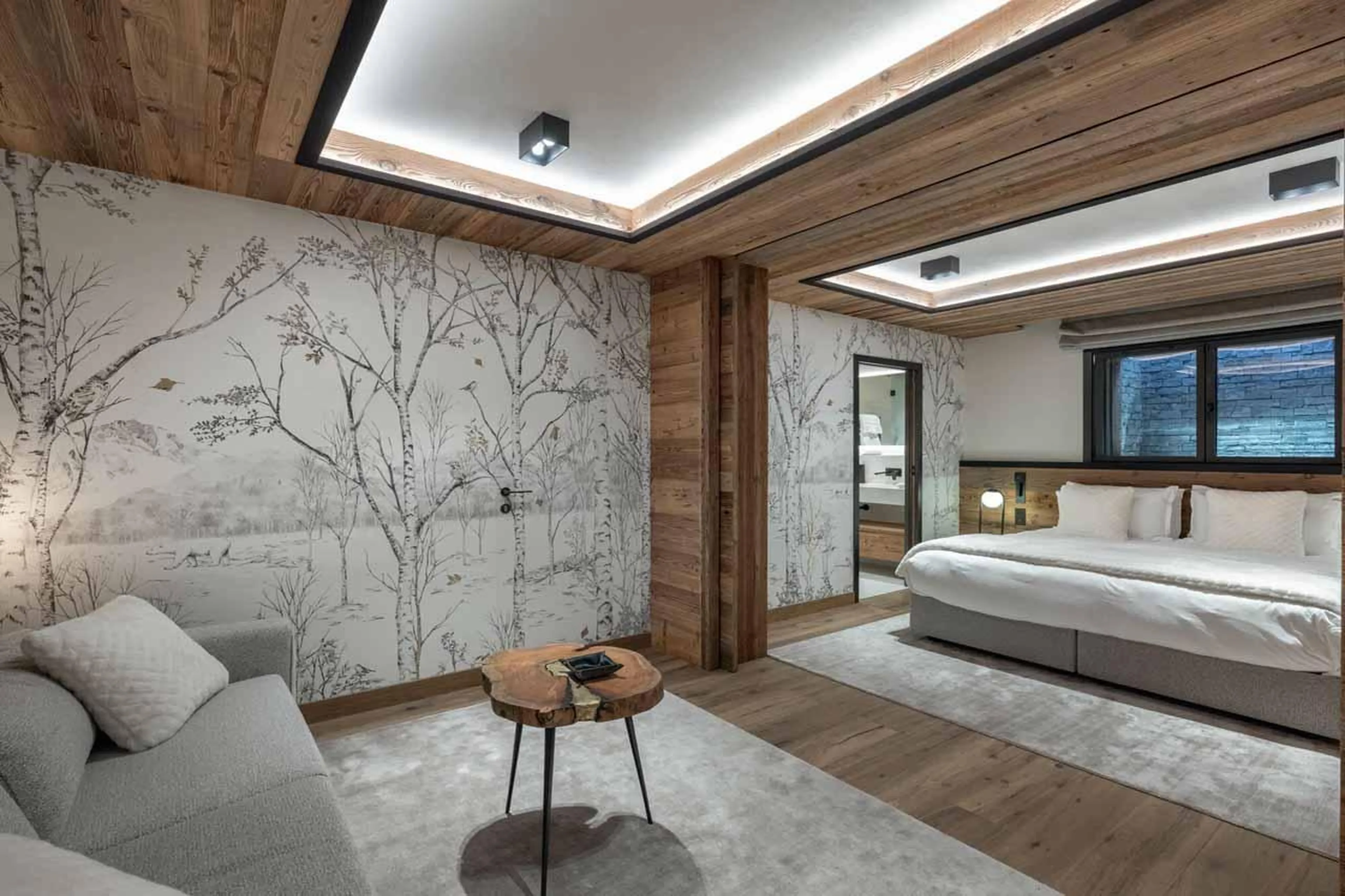 Double bedroom with sofa in Chalet Grizzly, Megeve