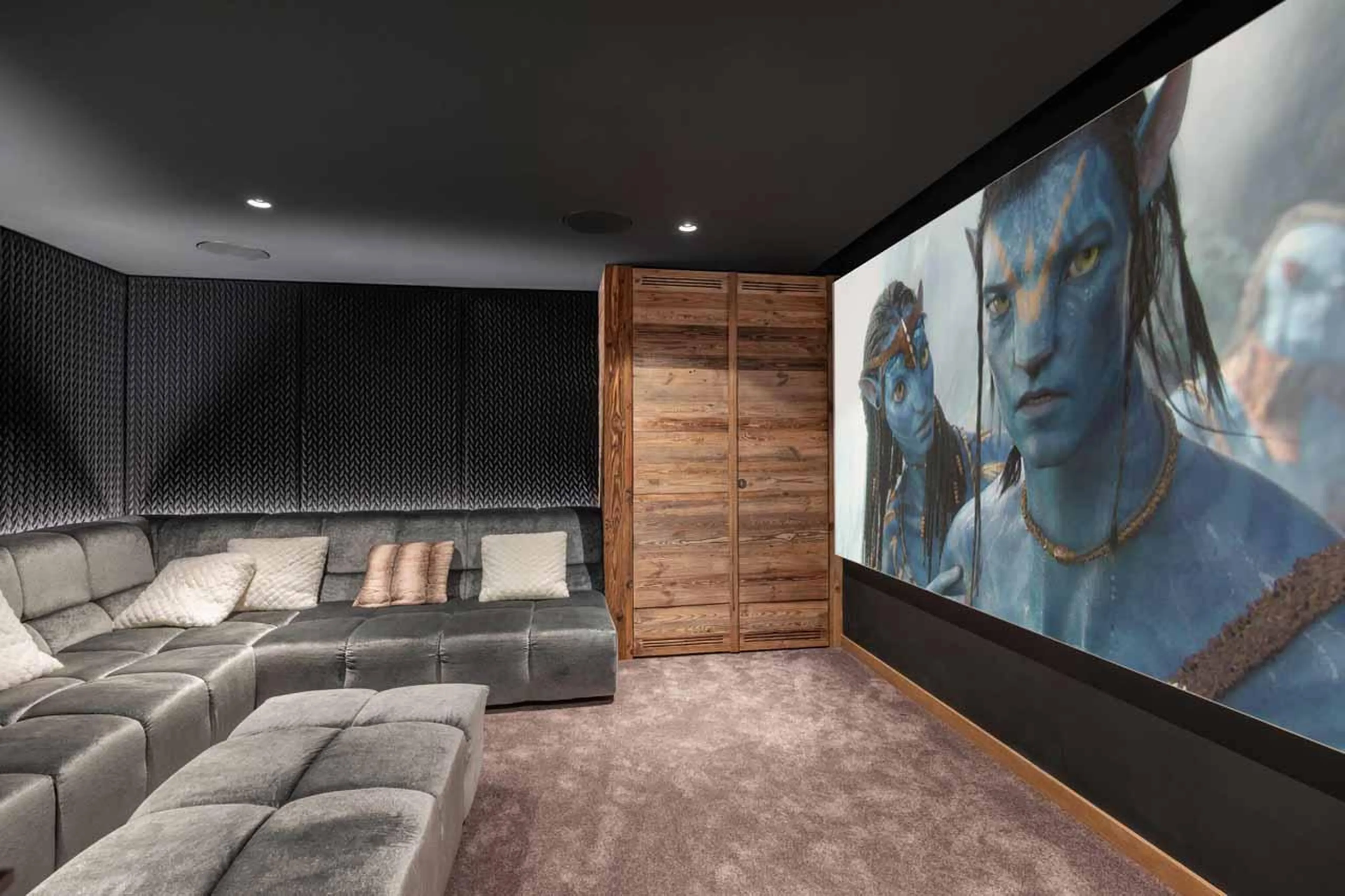 Cinema room with plush sofa in Chalet Grizzly, Megeve