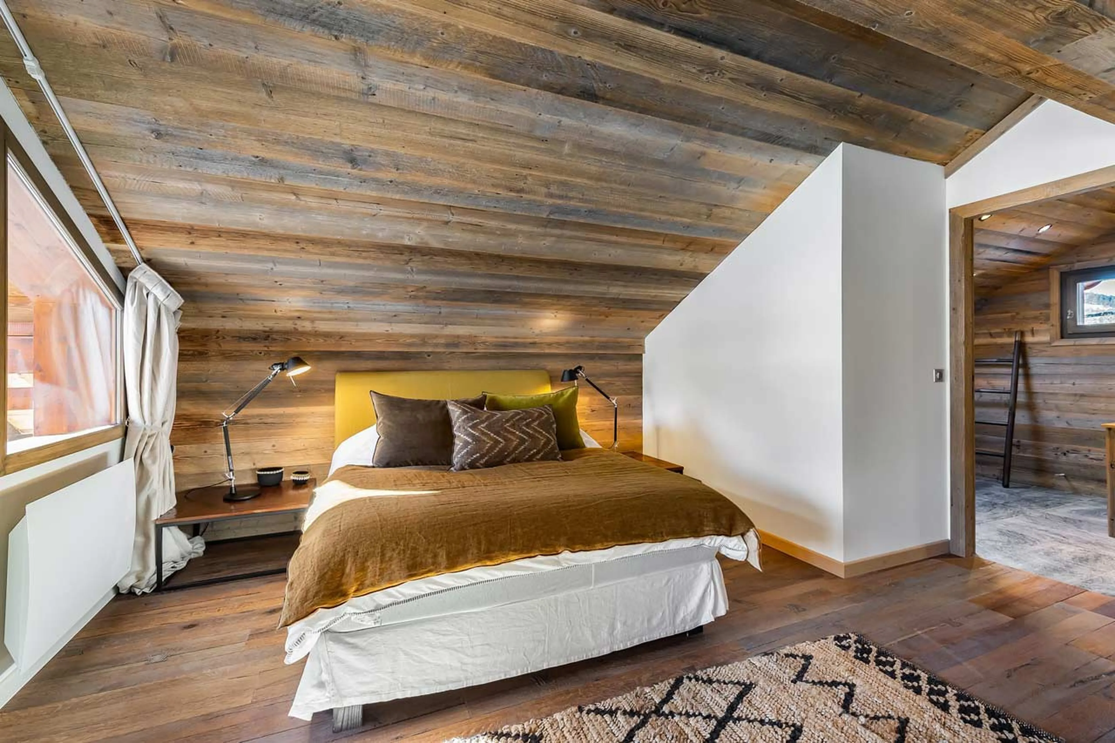 Bedroom one balcony access at Chalet Haapiti in Meribel