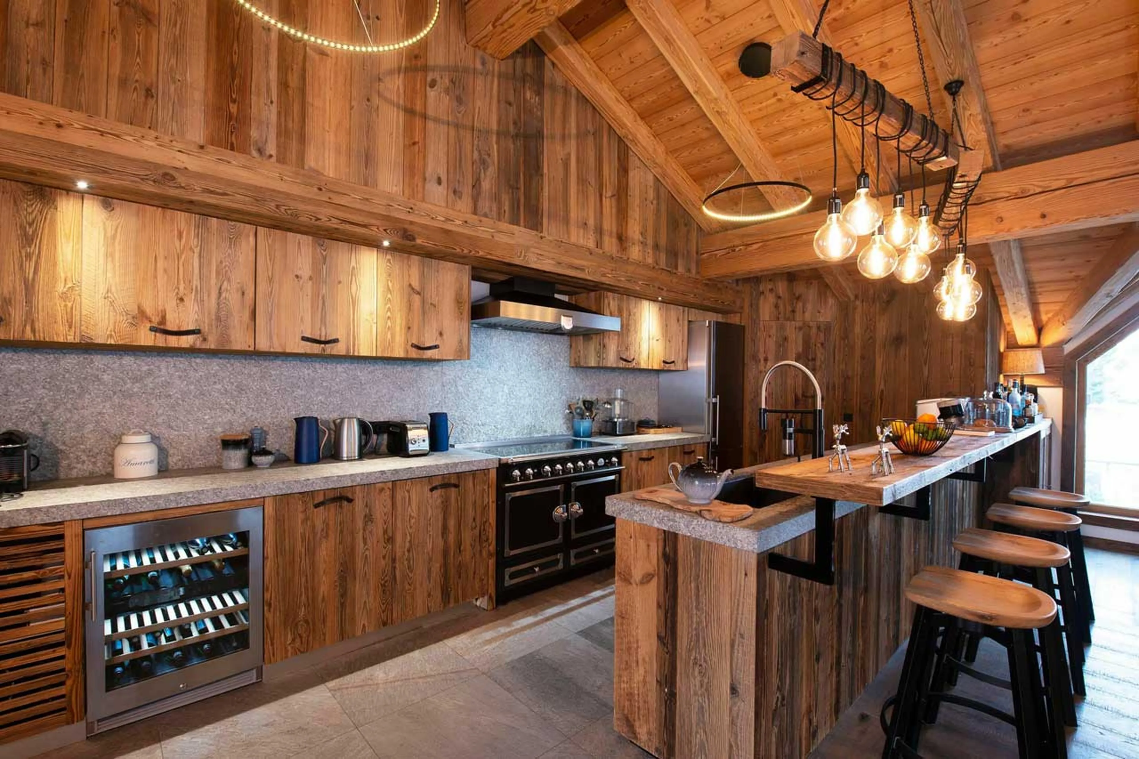 Kitchen with breakfast bar at Chalet Hermine Blanche in Val d'Isere