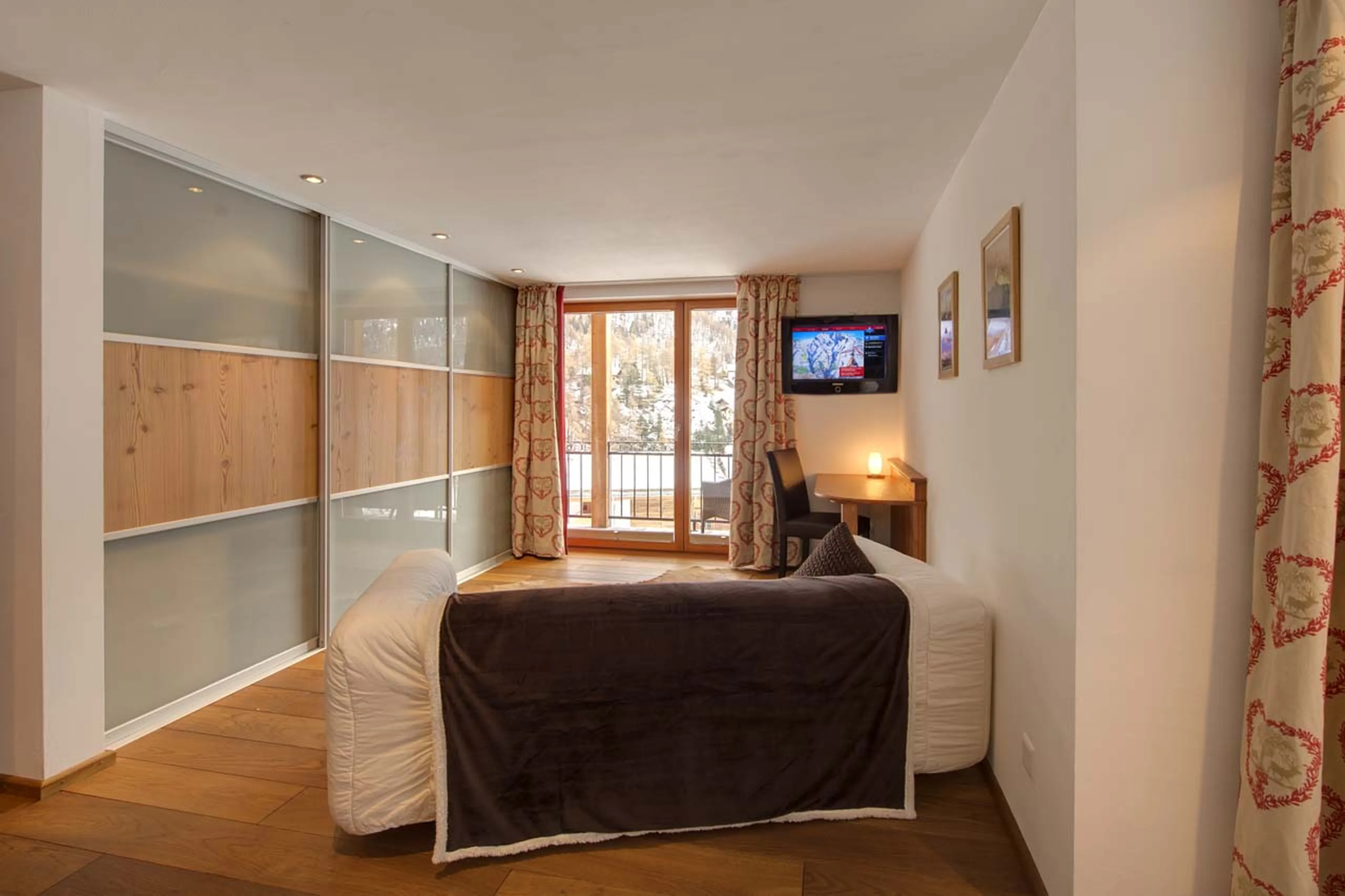 Sitting area in bedroom one at Chalet Ibron in Zermatt