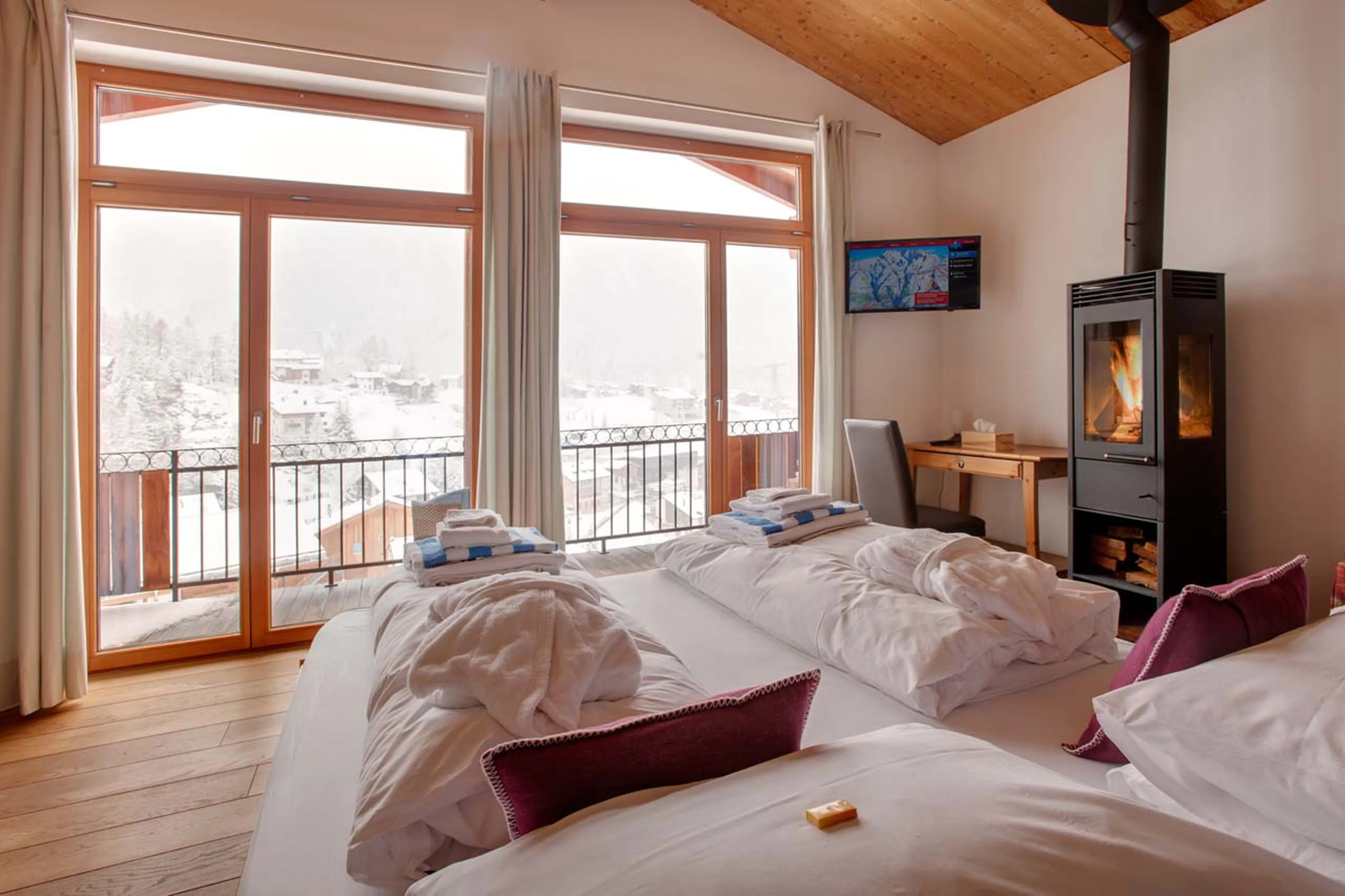 Bedroom three wood burner at Chalet Ibron in Zermatt