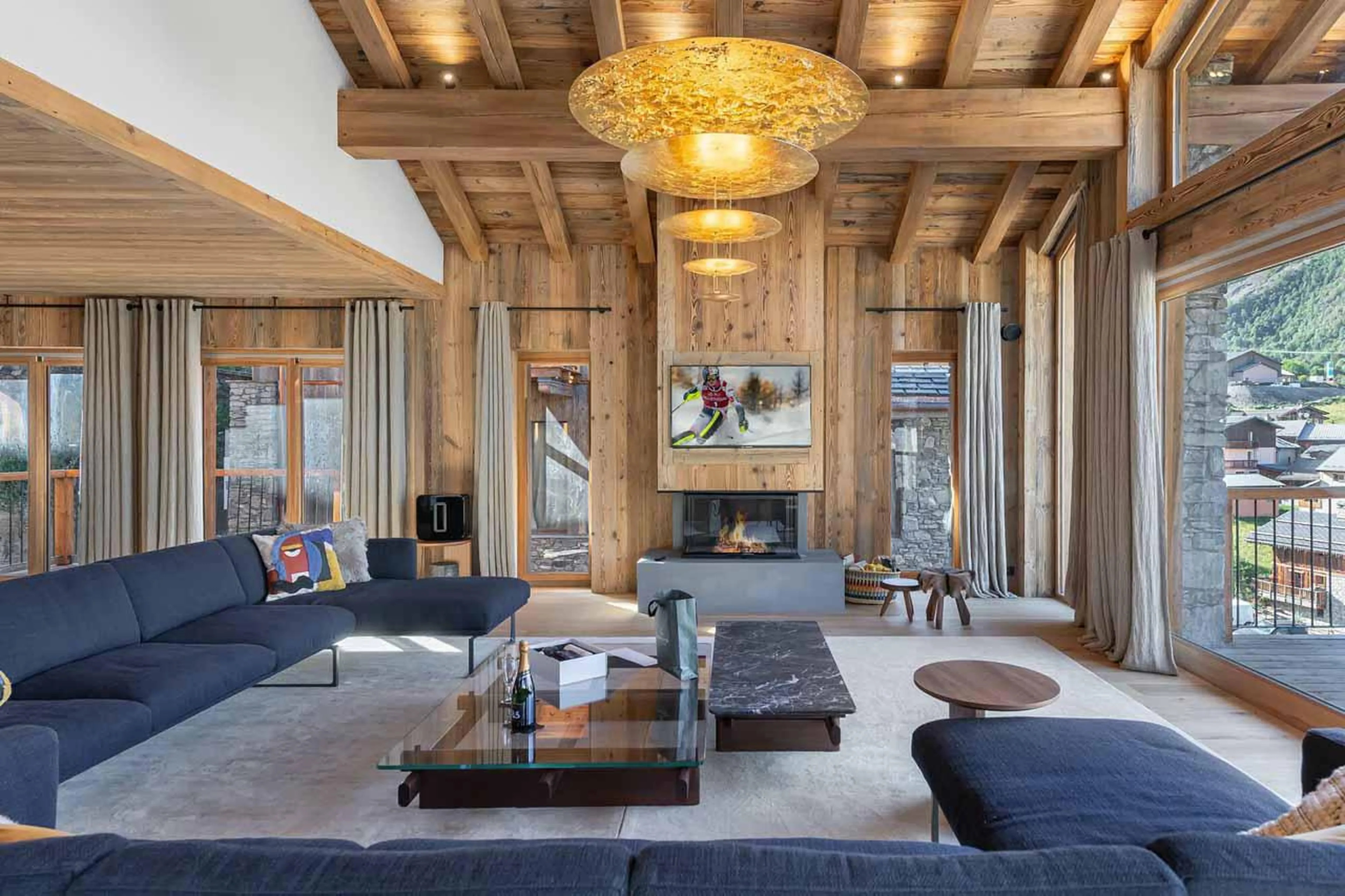 Fireplace in living area at Chalet Imladris in St Martin de Belleville