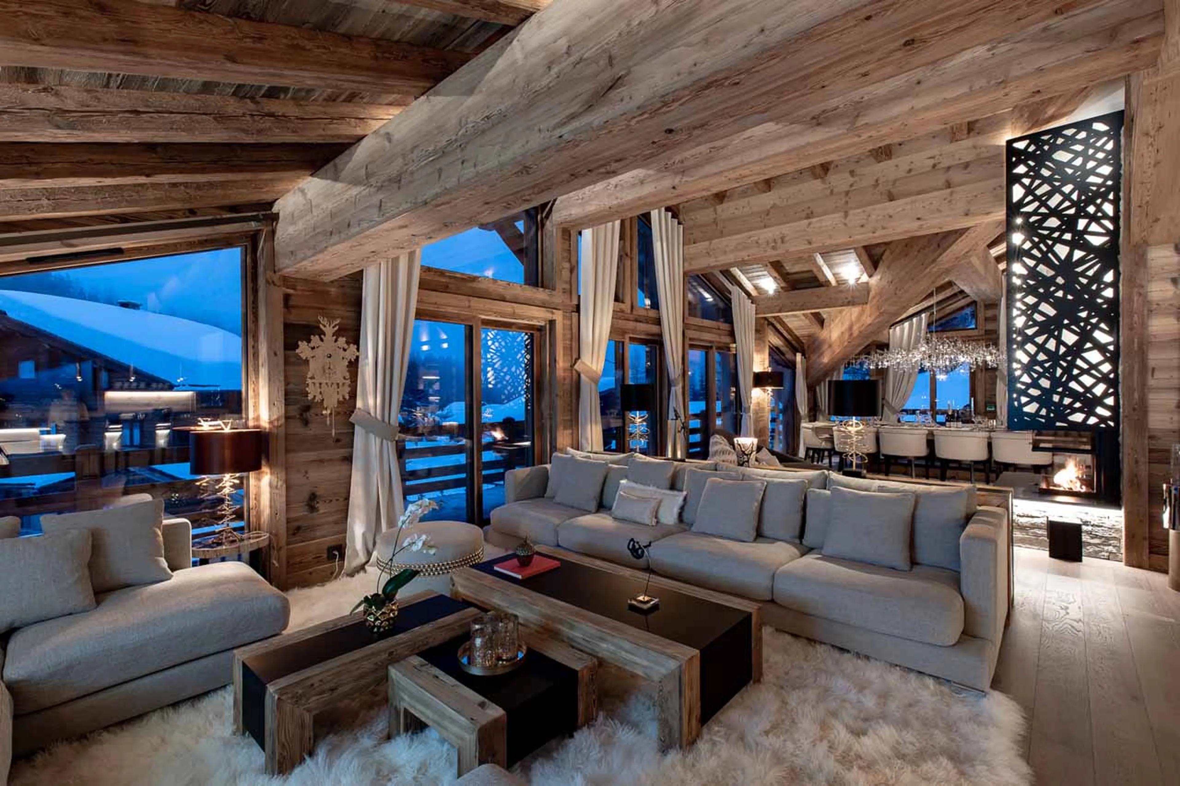 Open plan living area at night at Chalet Infinity in Chamonix