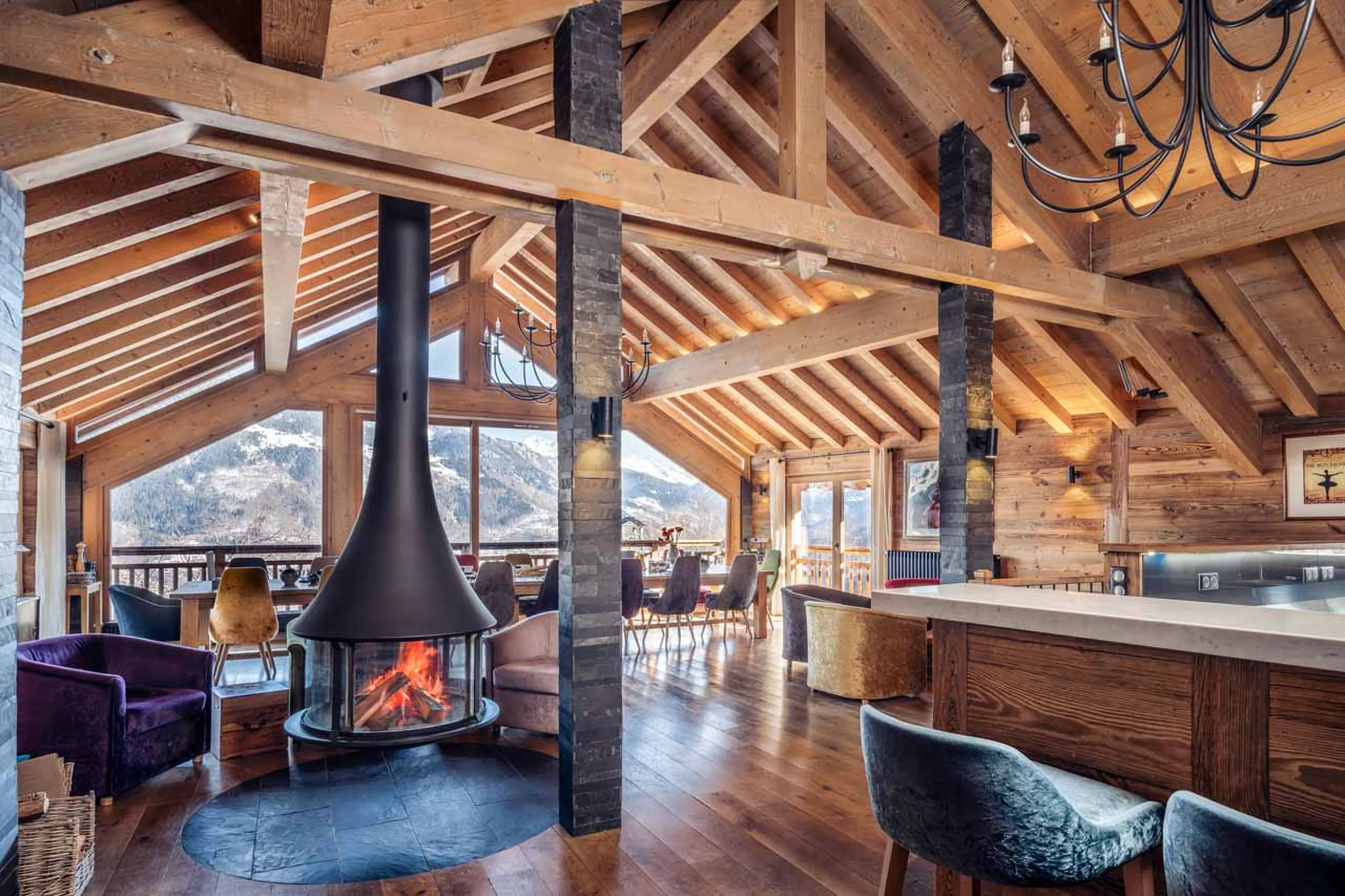 Dining area fireplace at Chalet Iona in Meribel
