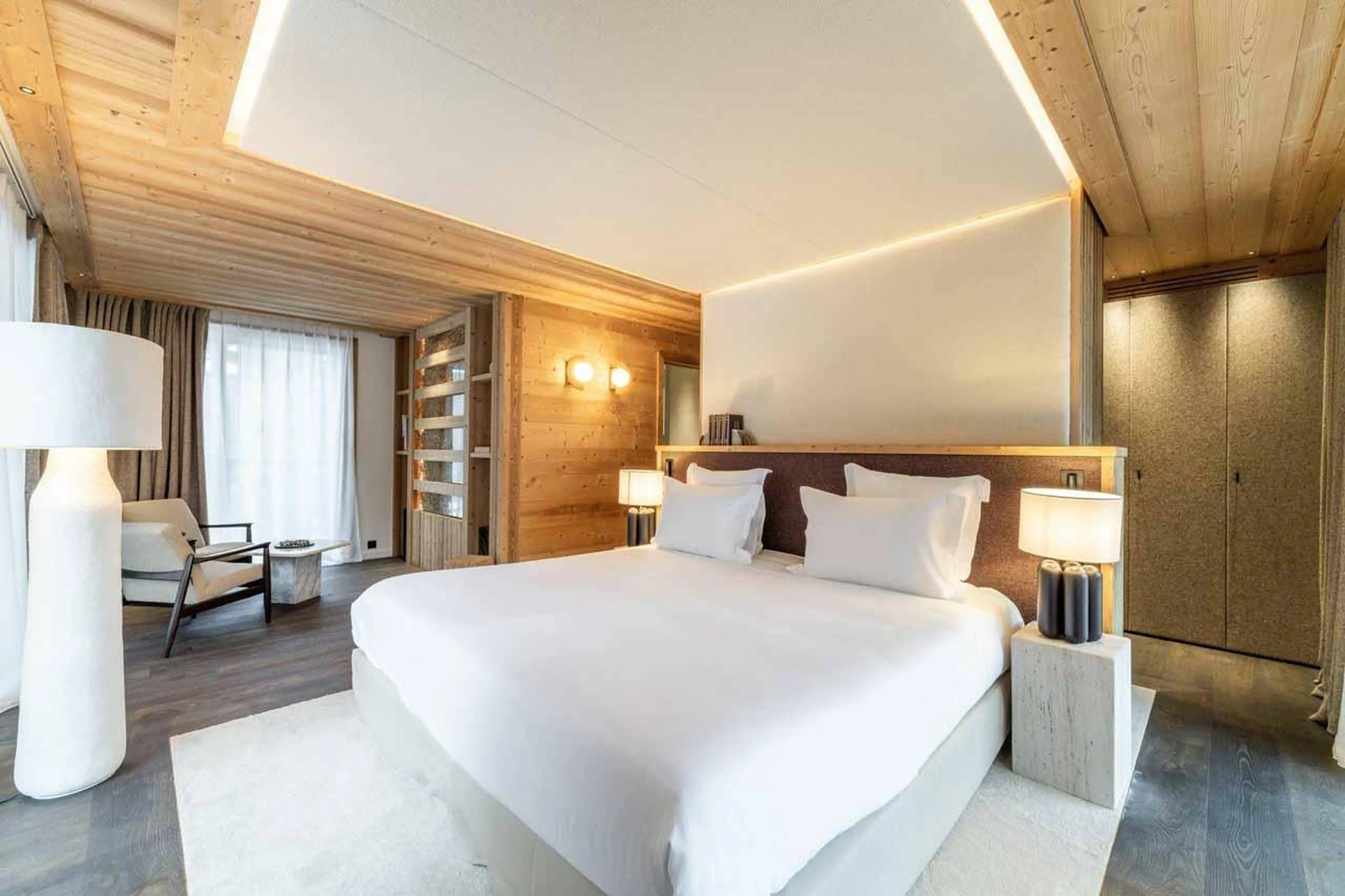 Double bedroom with sitting area in Chalet Irbis, Courchevel Le Praz