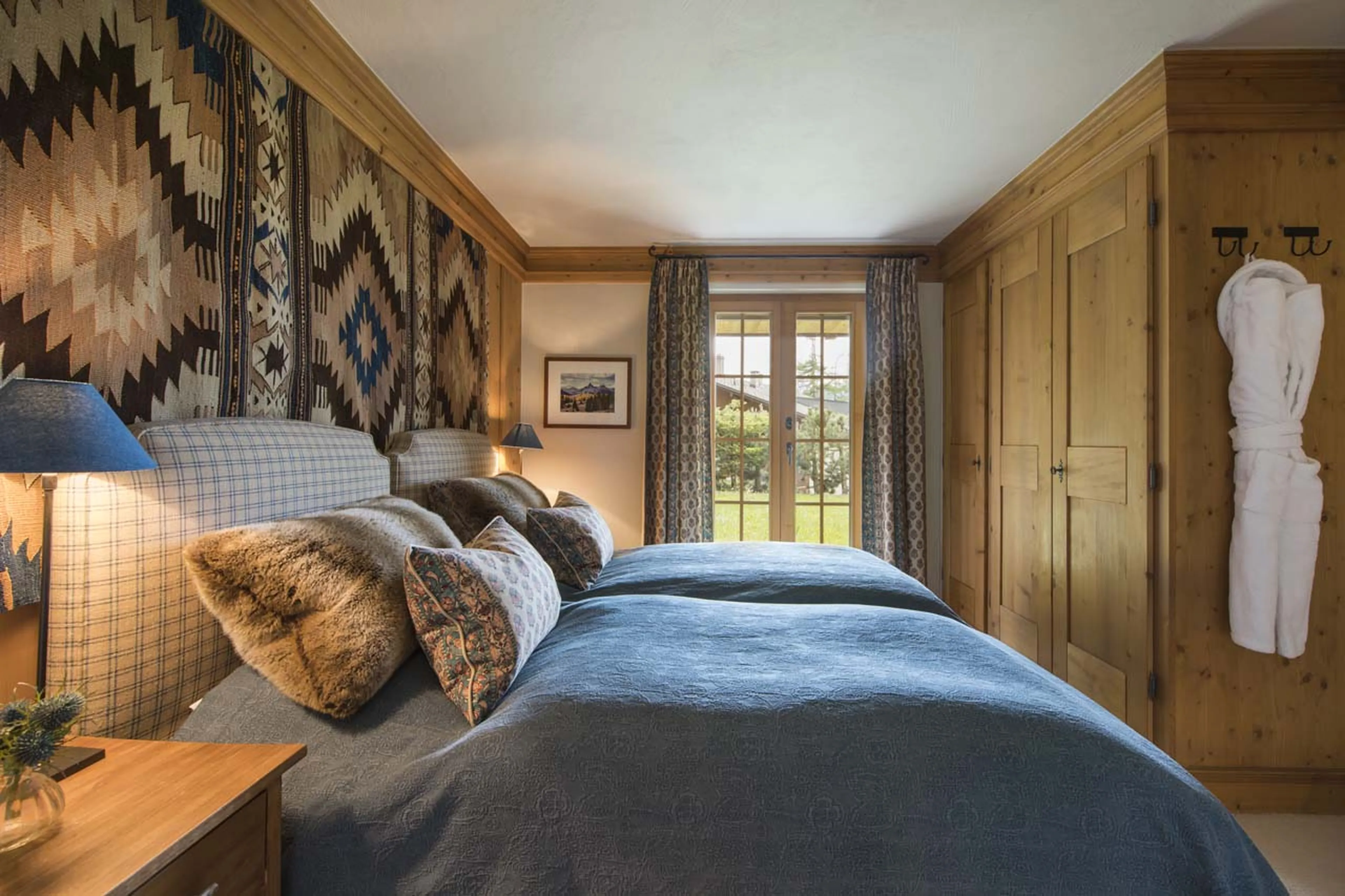 Bedroom three garden access in Chalet Ivouette in Verbier