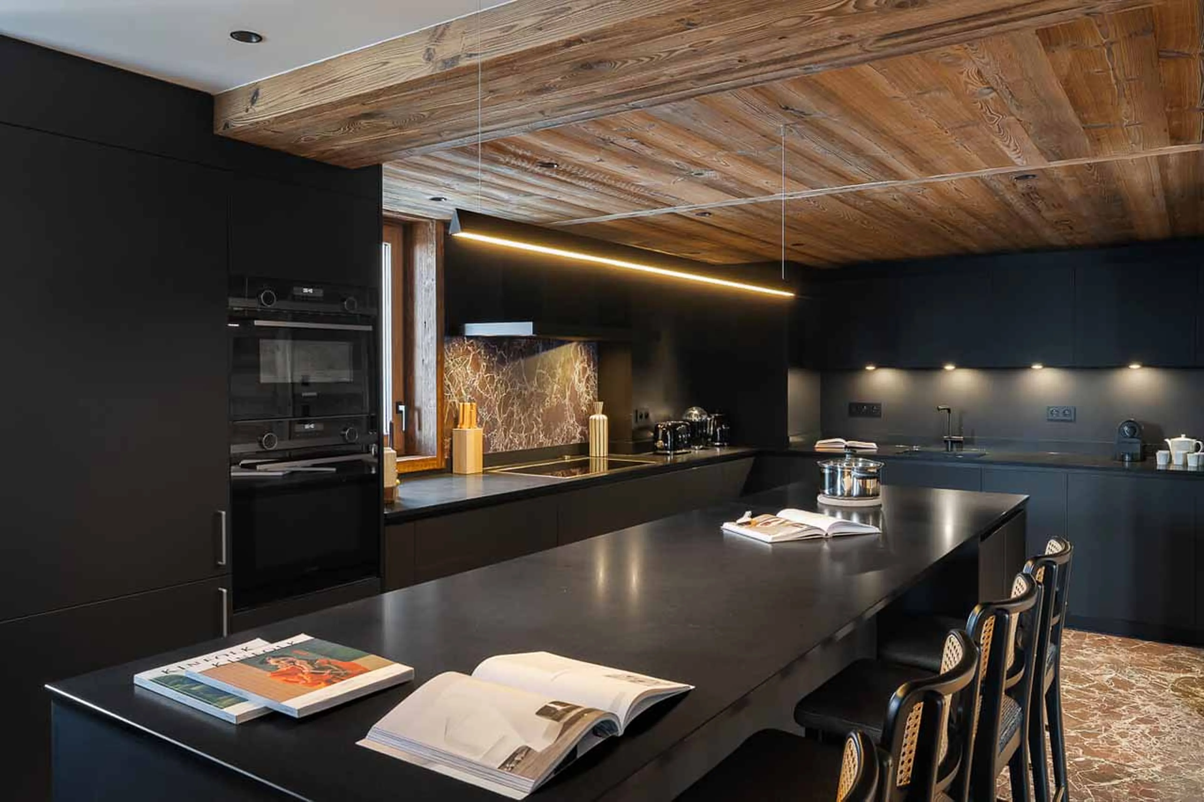 Dining area and kitchen at Chalet J in Meribel