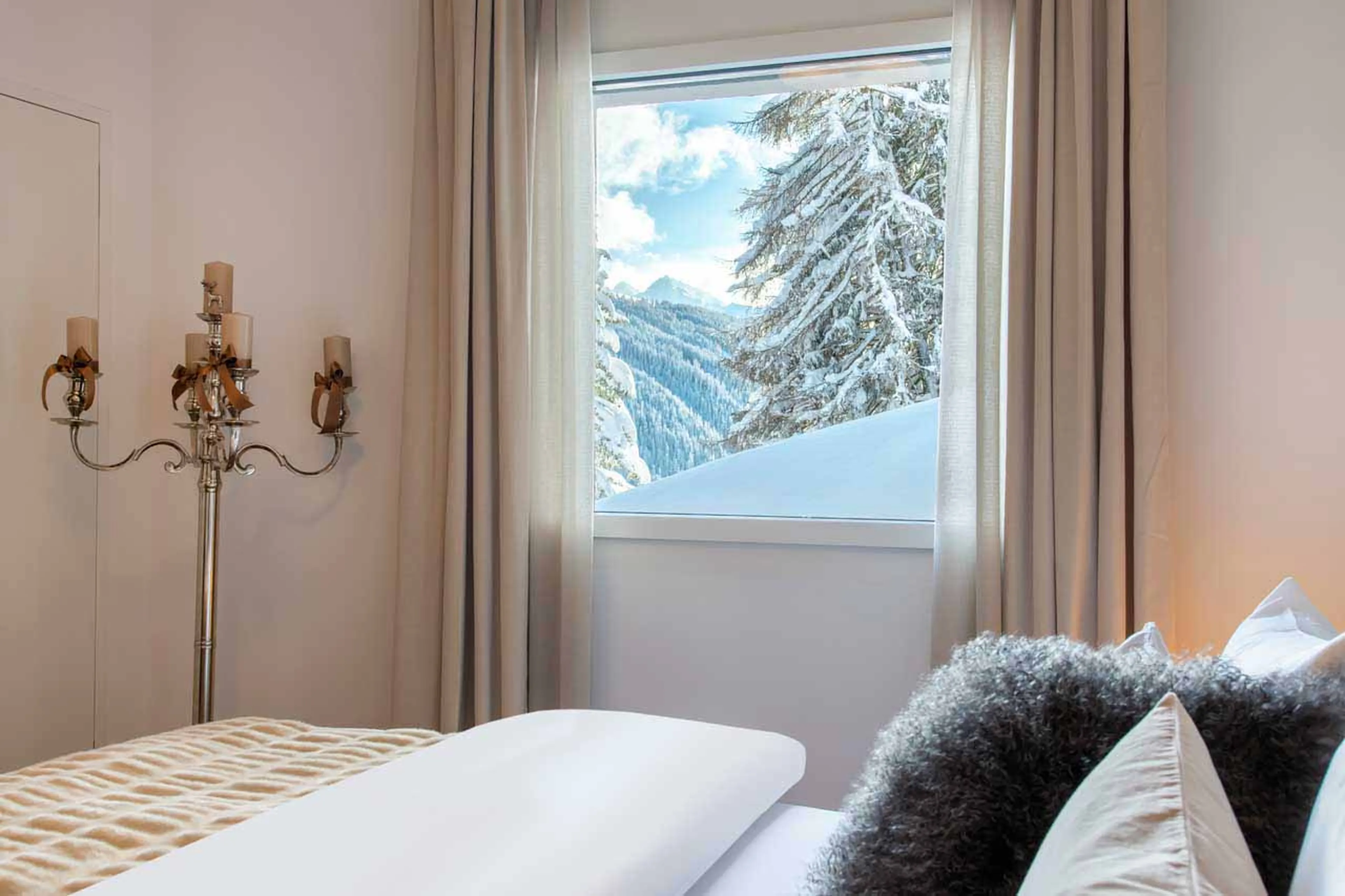 Mountain views from bedroom window at Chalet Jakobshorn in Davos