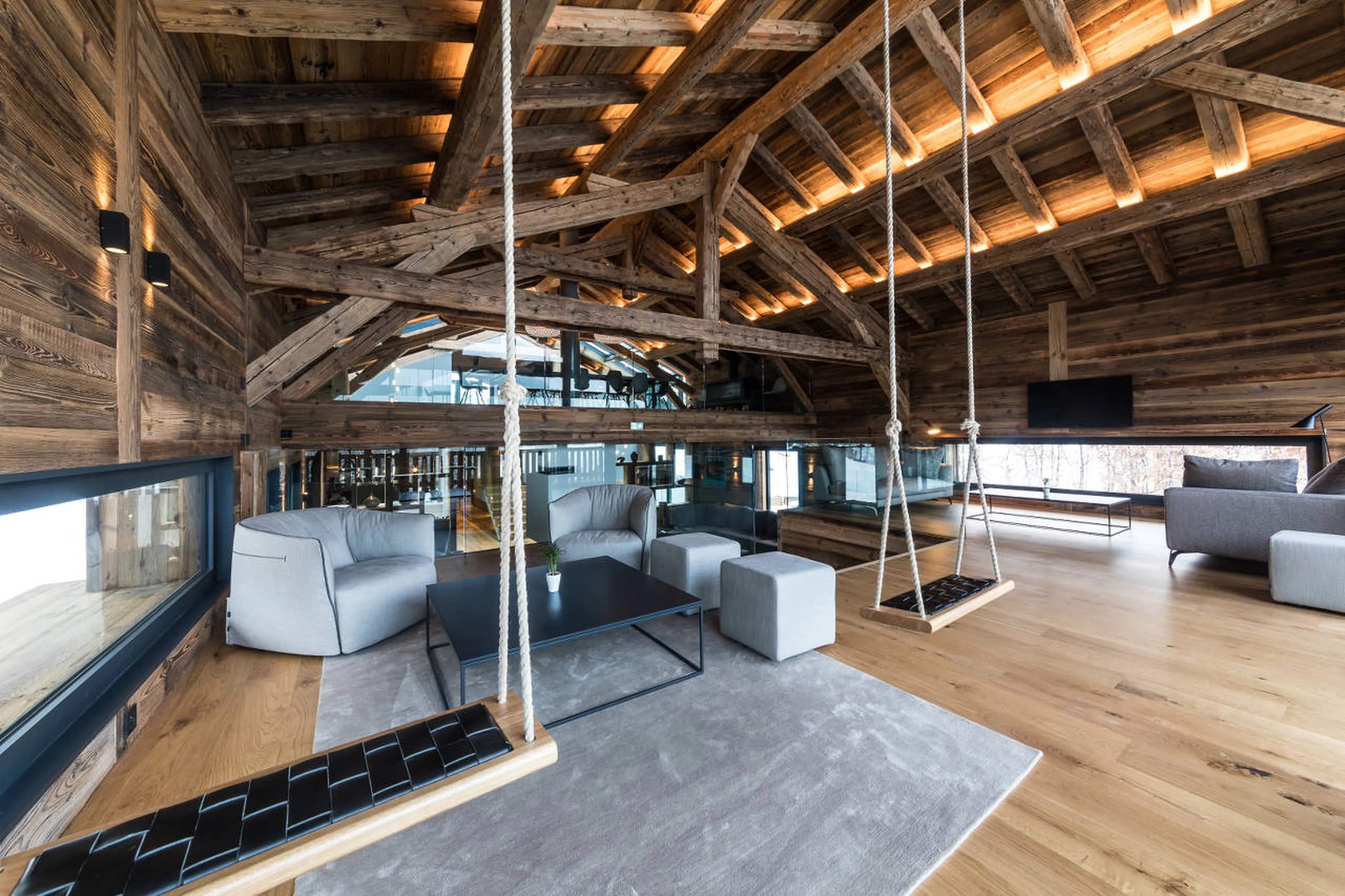 Swing seats in library of Chalet Joux Plane in Morzine