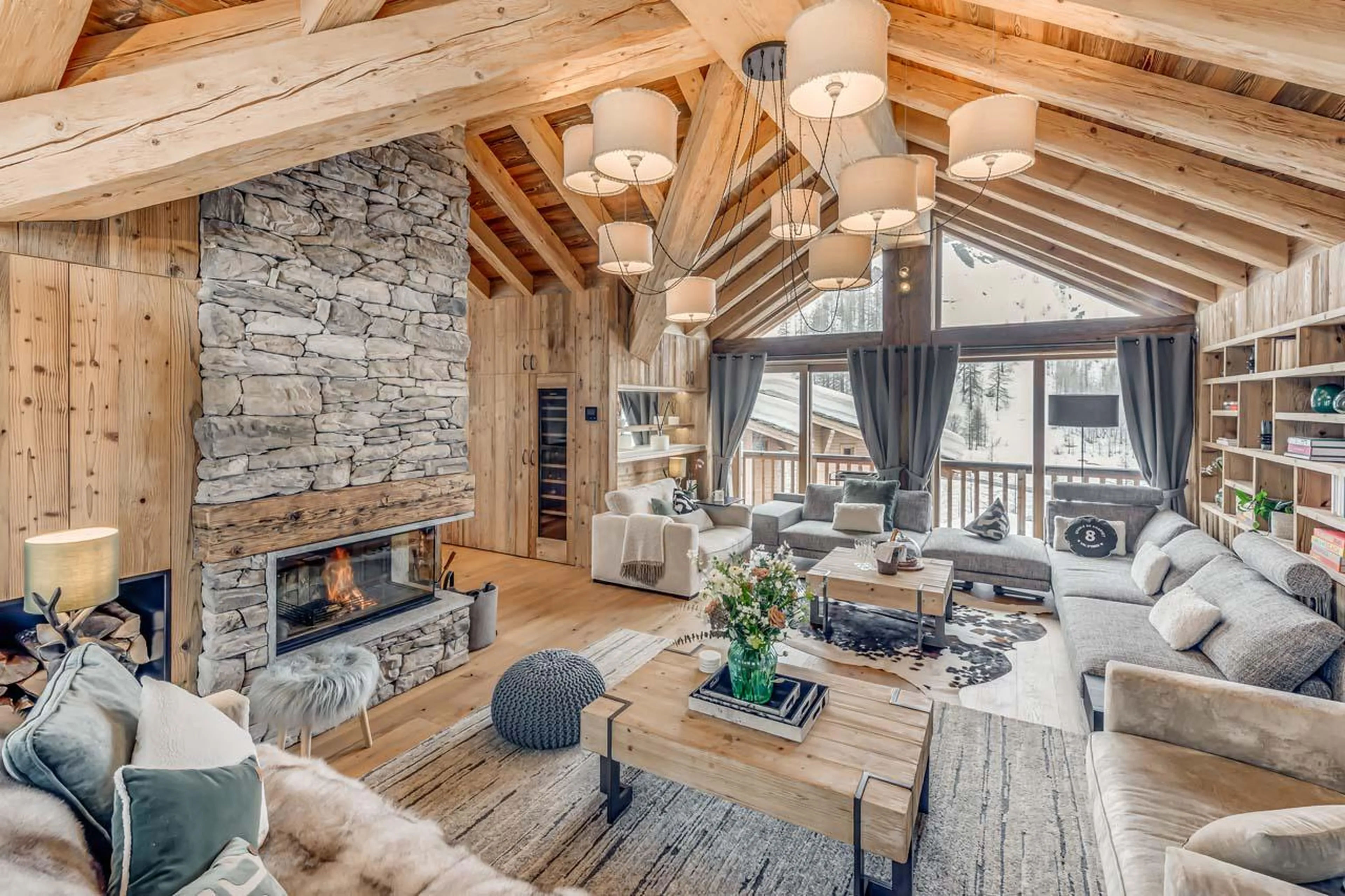 Fireplace and balcony access Chalet Juno in Val d'Isere