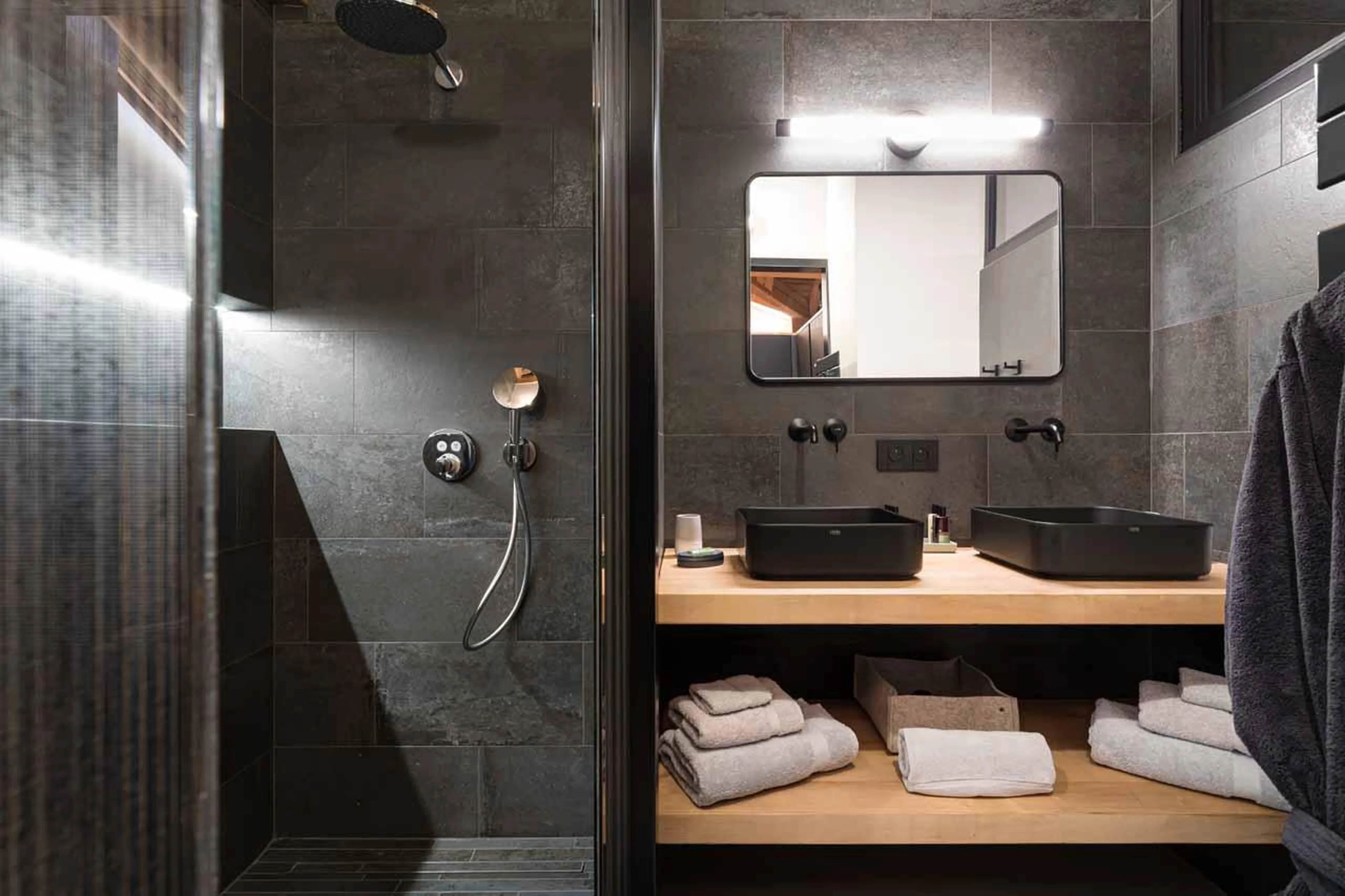 En-suite shower room with walk-in shower and double basin at Chalet Kandahar in Courchevel 1550