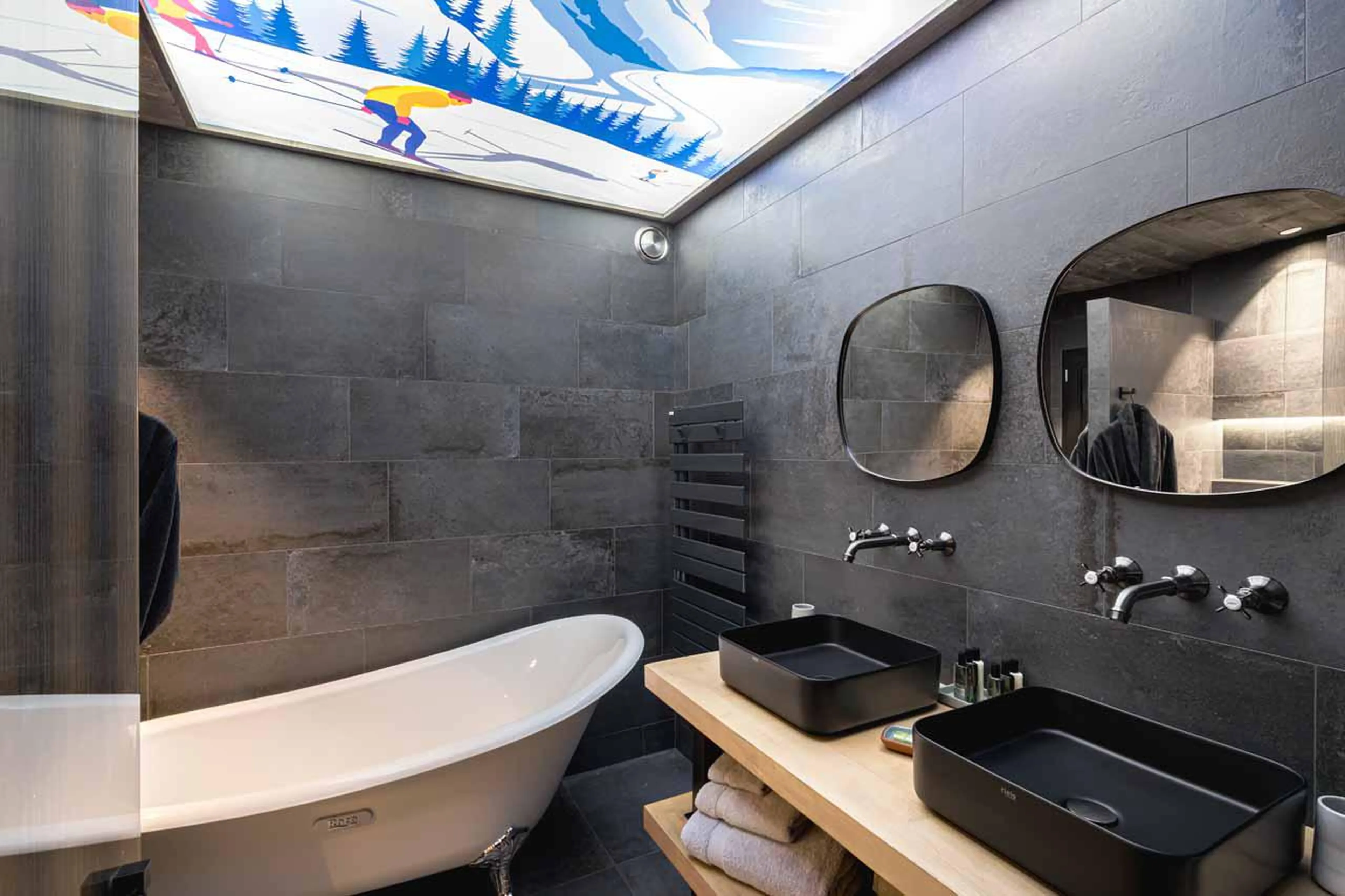 En-suite bathroom with double basin at Chalet Kandahar in Courchevel 1550