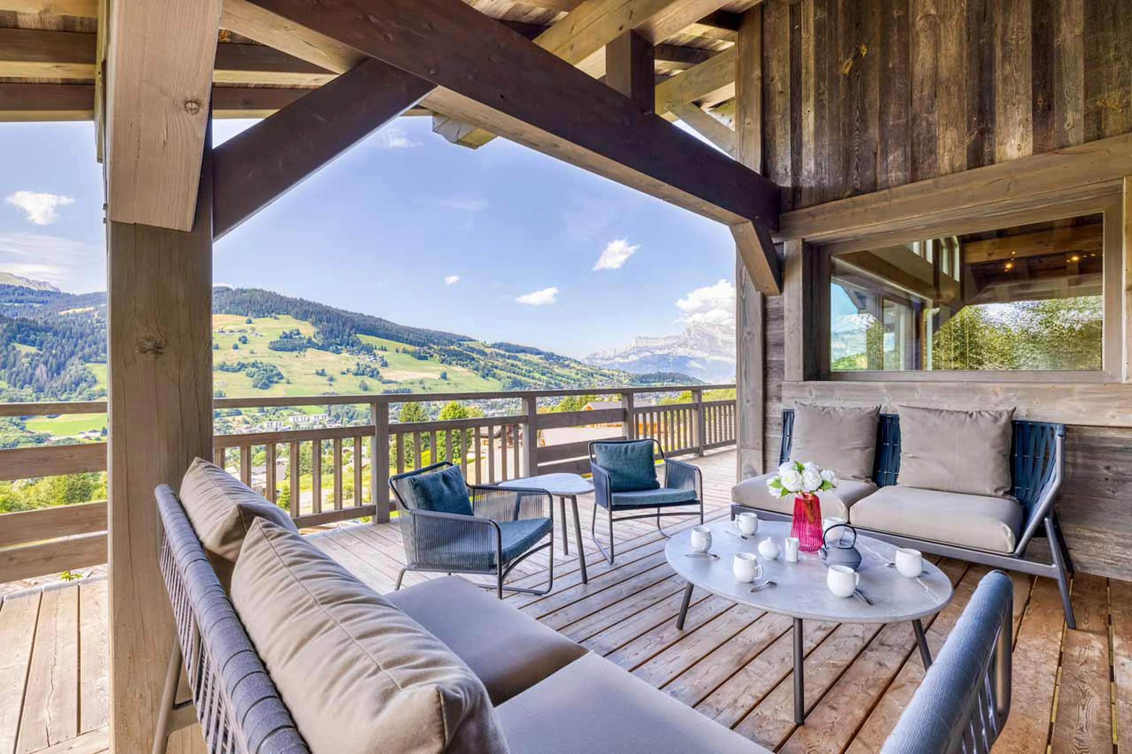 Balcony overlooking spectacular mountain peaks at Chalet Kantaa in Megeve