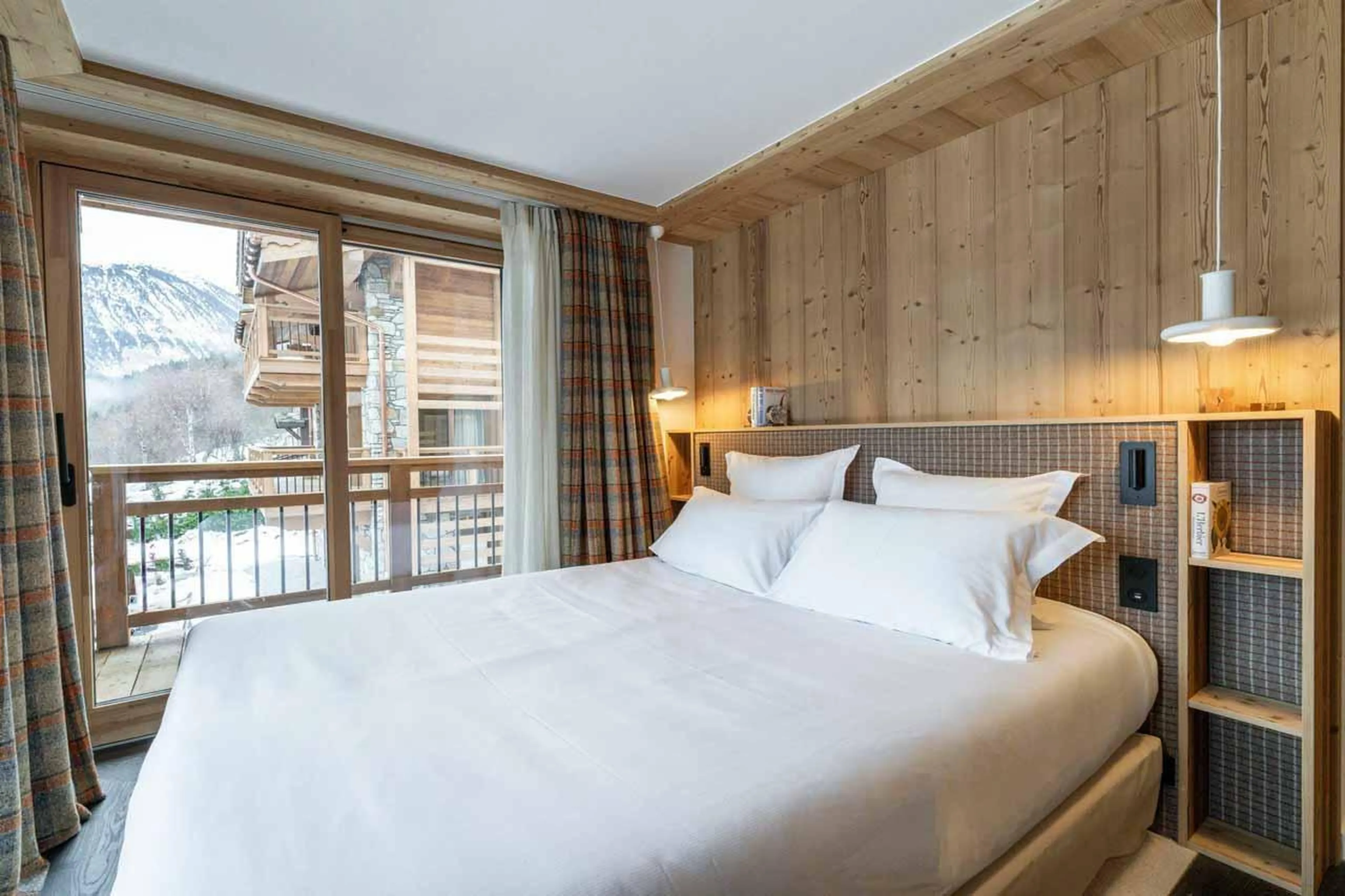 Double bedroom with sliding glass doors in Chalet Khoton, Courchevel Le Praz