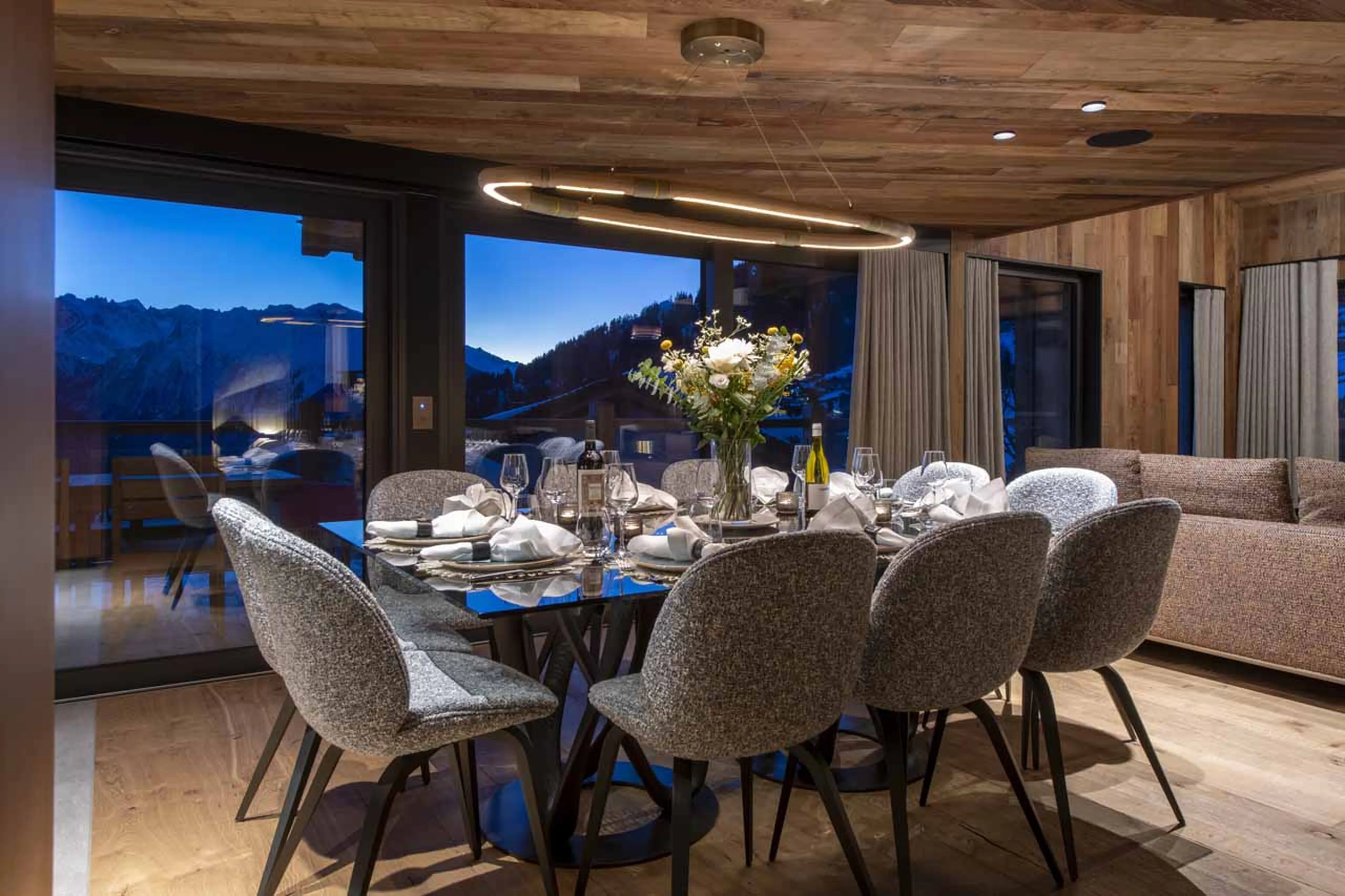 Dining table and glass doors in Chalet Kitsilano, Verbier