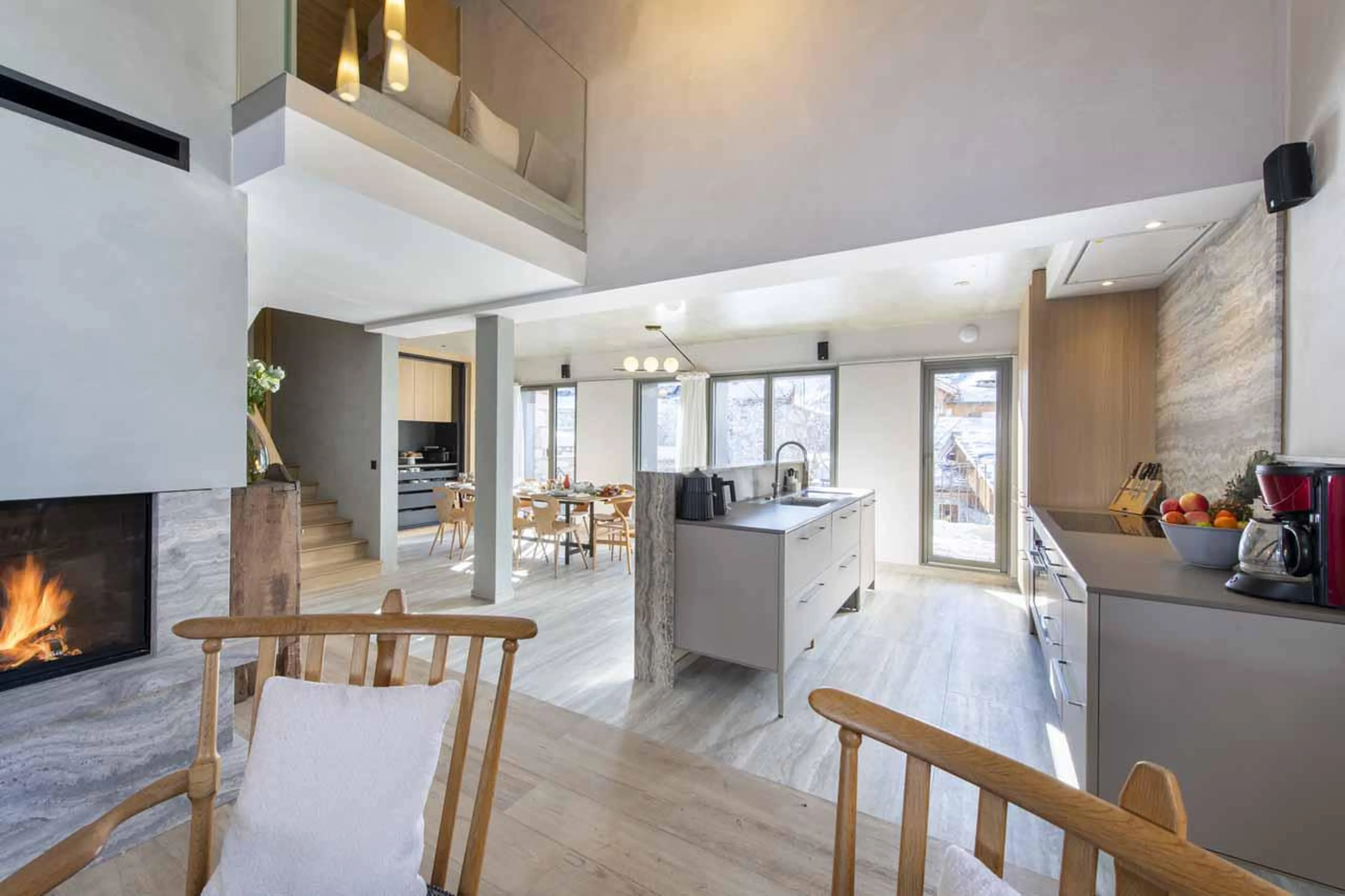 Open-plan kitchen with marble countertops at Chalet Kitsune in Val d'Isere