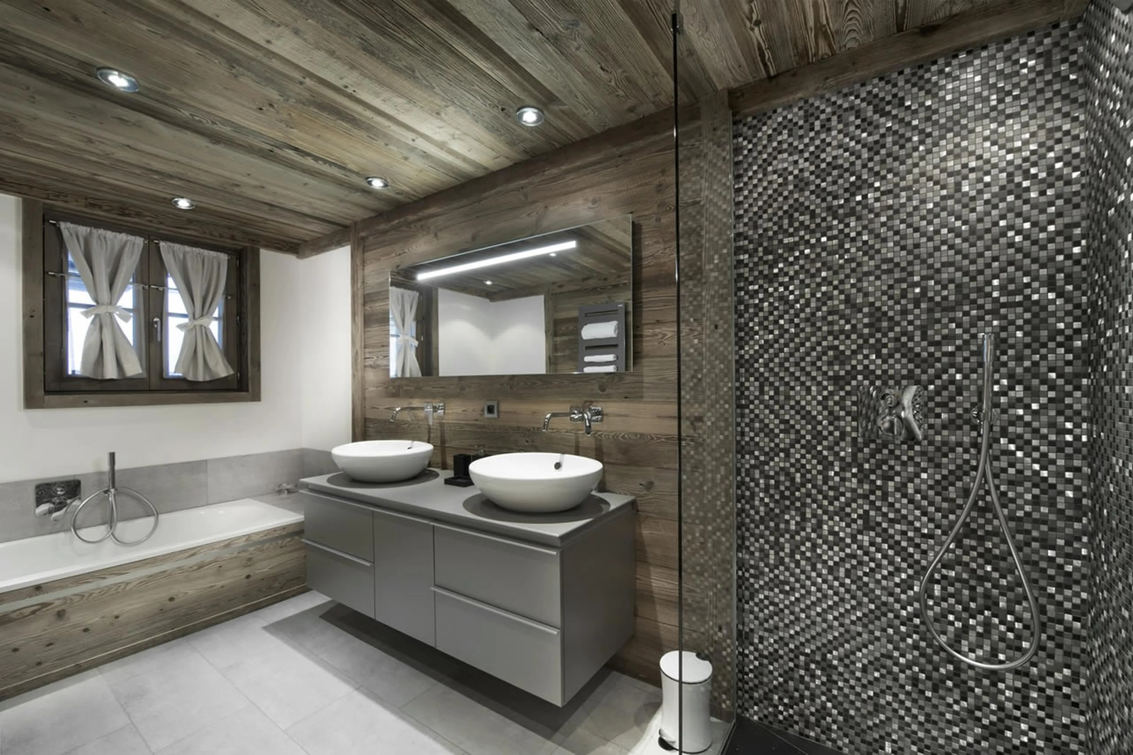 En-suite bathroom with bath, double basin and shower in Chalet L’ Or Blanc in Courchevel 1550