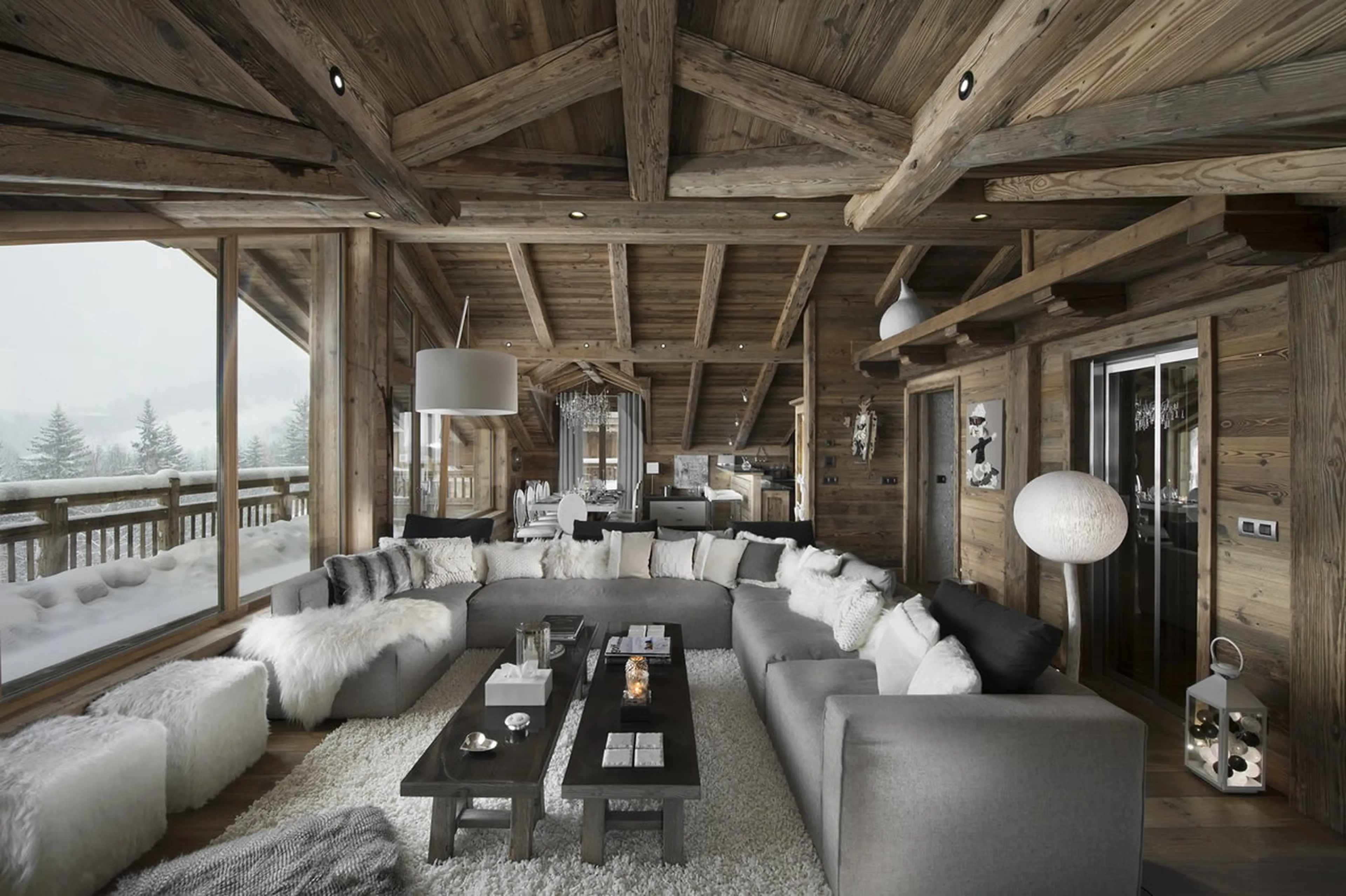 Spacious lounge with central fireplace of Chalet L’Or Blanc in Courchevel 1550
