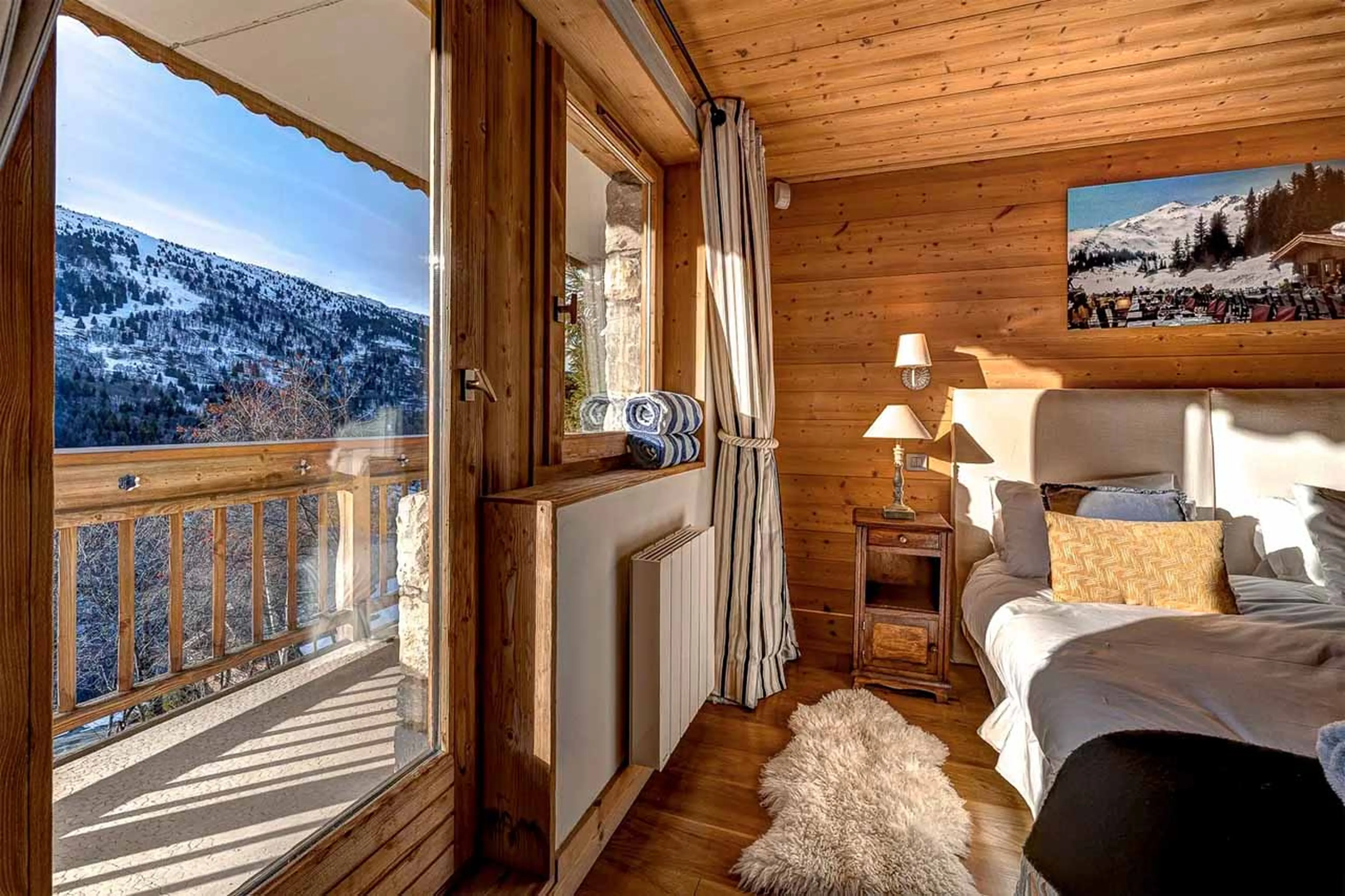 Access to balcony from bedroom at Chalet La Chouette in Meribel