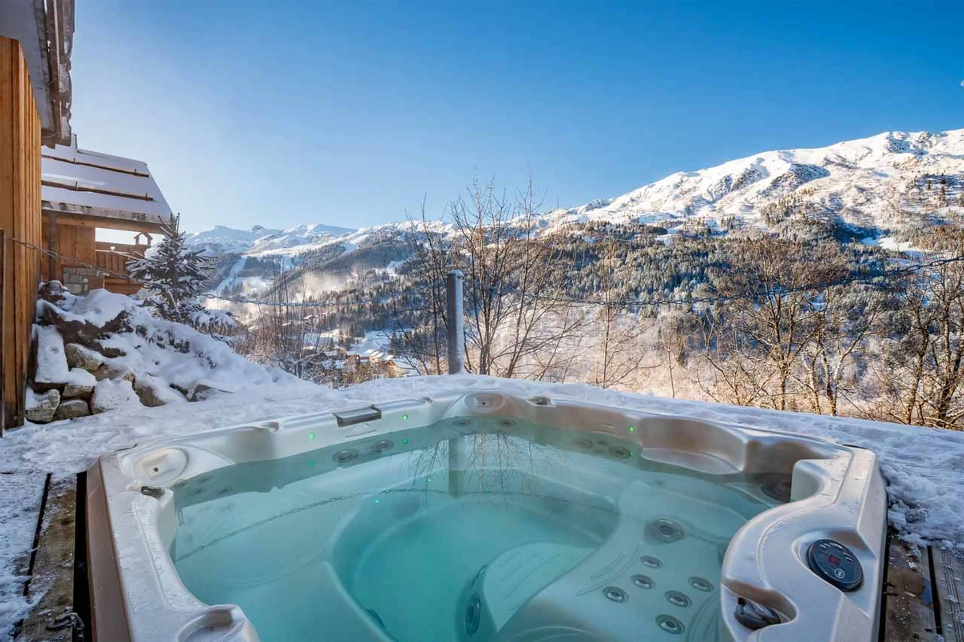 Sunken outdoor hot tub at Chalet La Chouette in Meribel