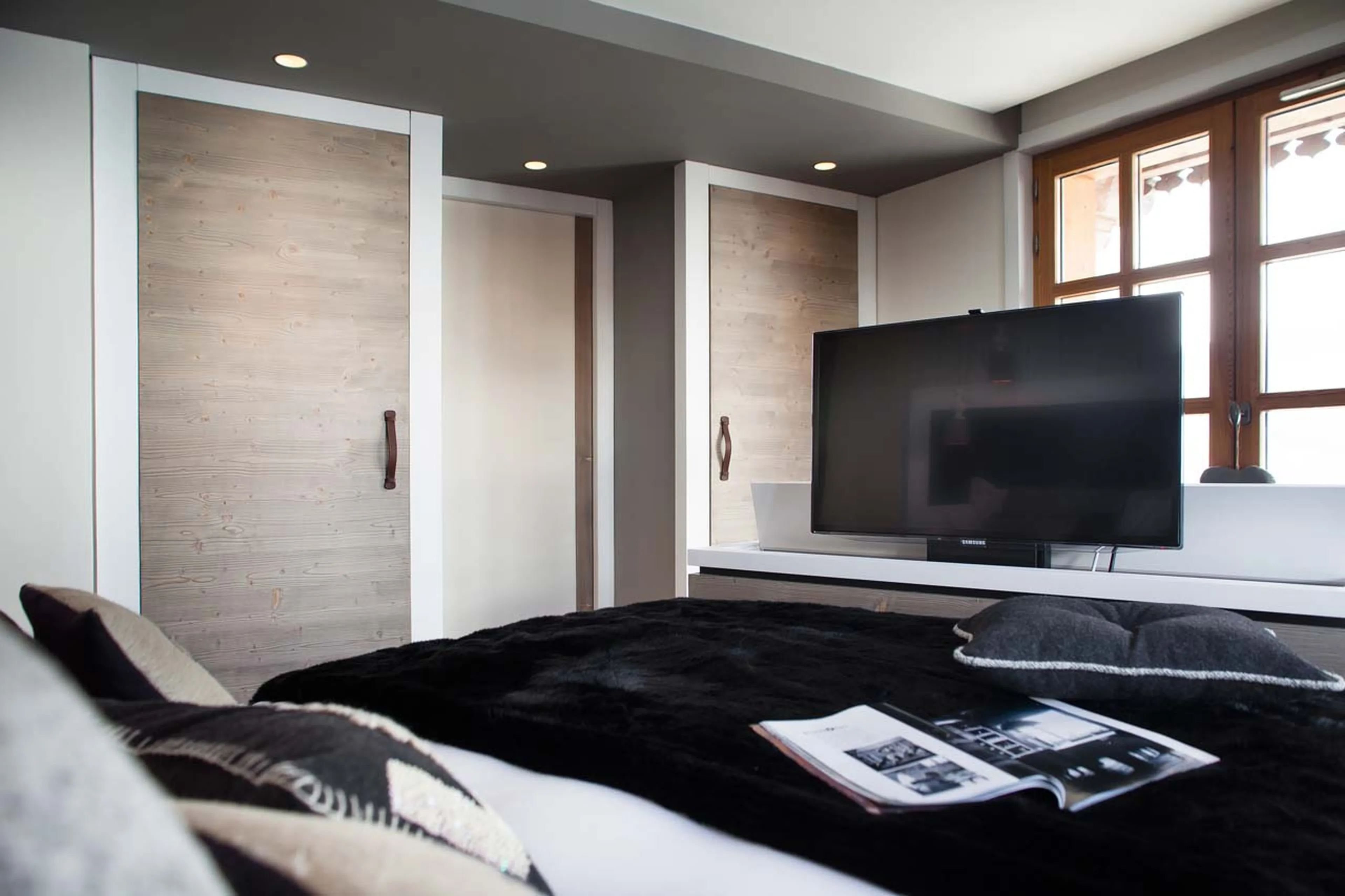 TV in double bedroom at Chalet La Colombe in Courchevel 1850