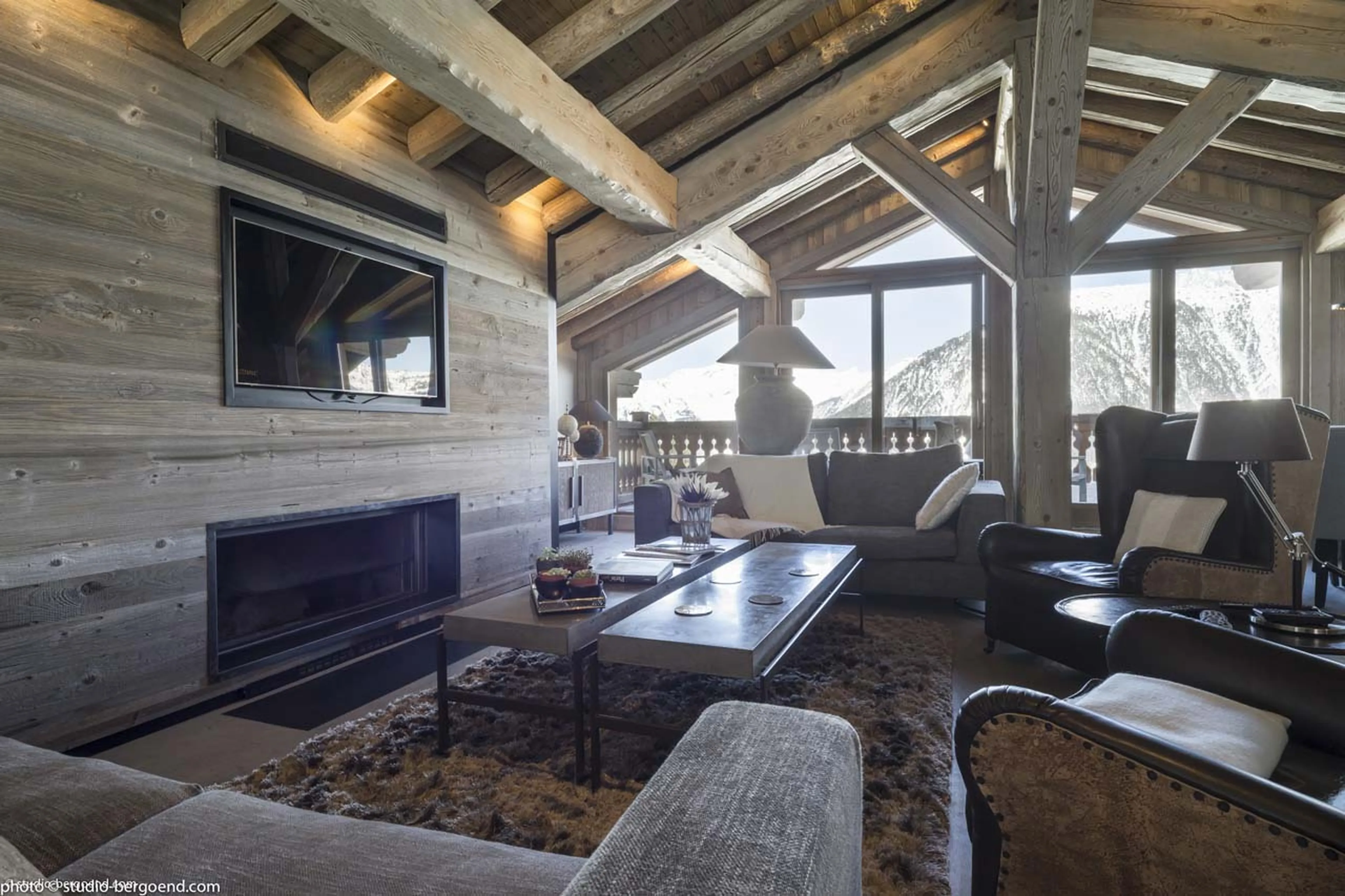 Living area with fireplace and TV at Chalet La Colombe in Courchevel 1850