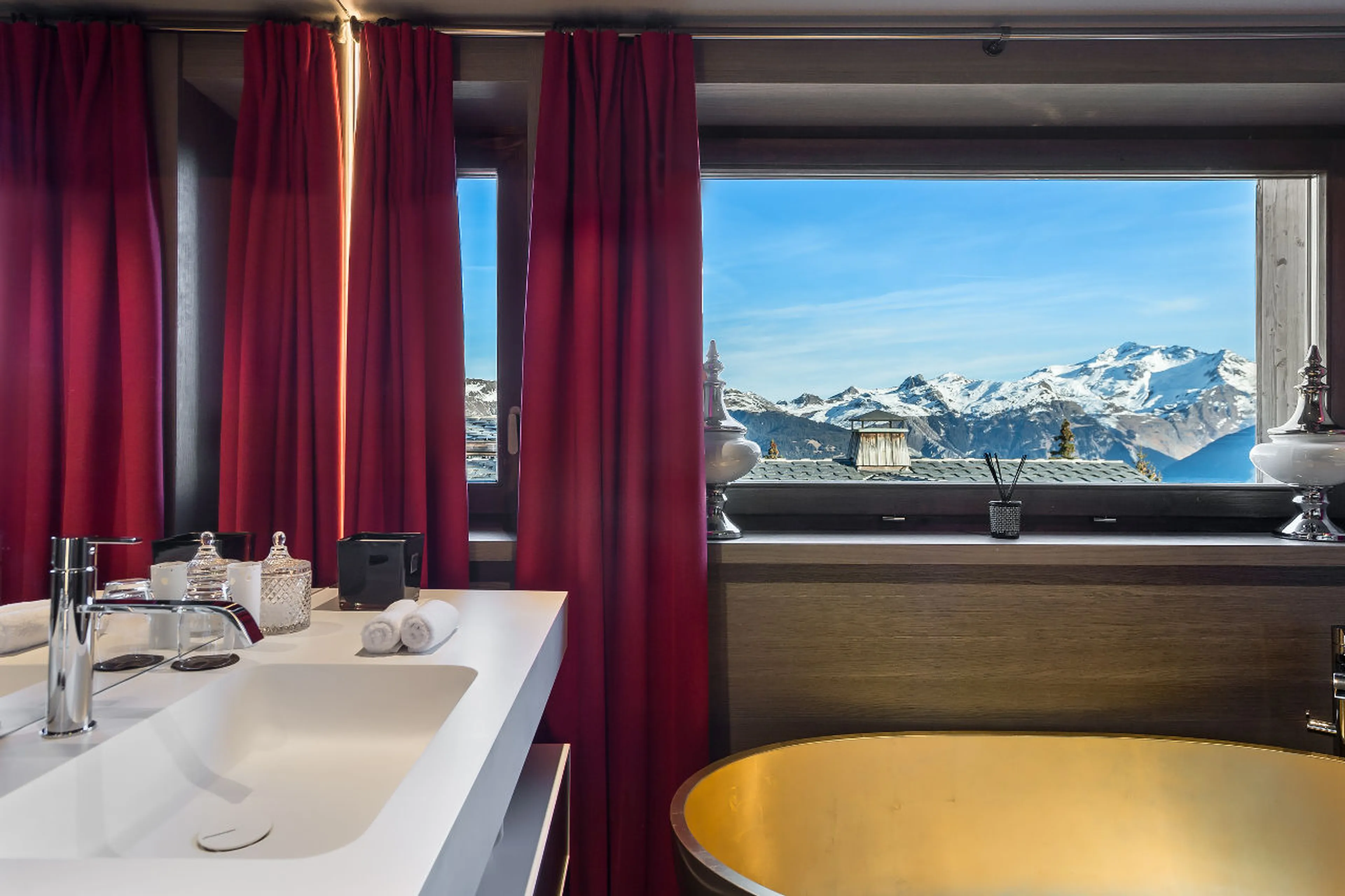 En suite bathroom with a mountain view in La Datcha in Courchevel 1850