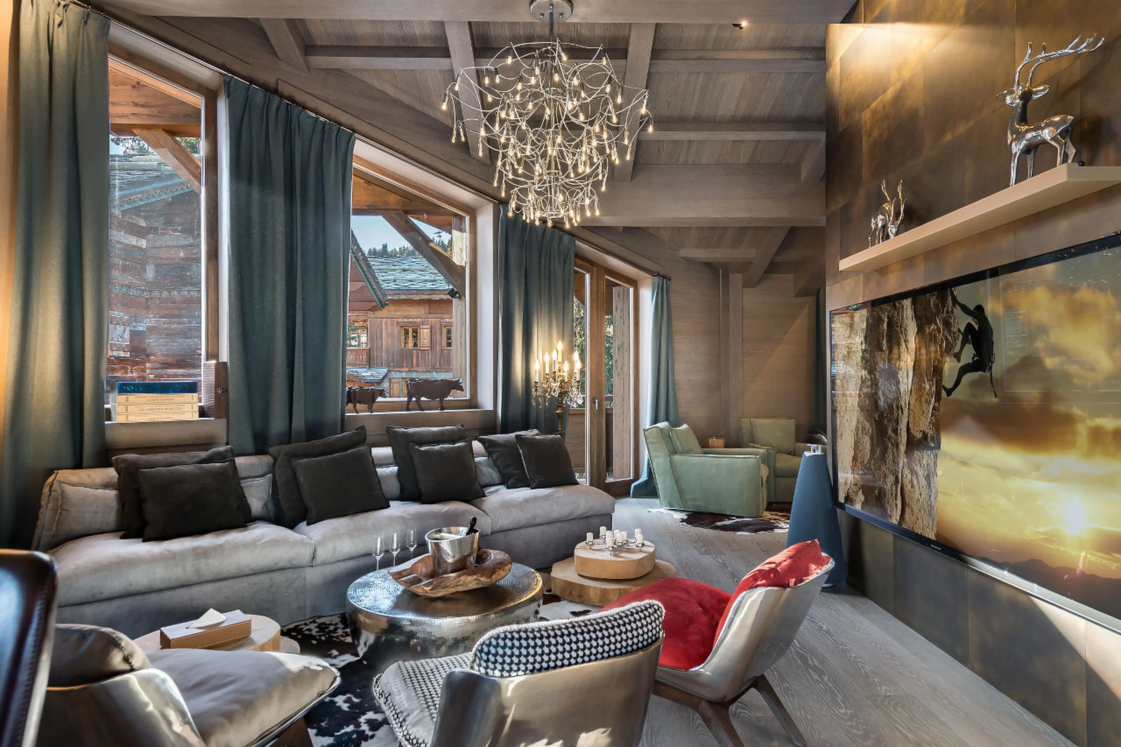 Chandeliers with gold leaf coverings in the living area of La Datcha in Courchevel 1850