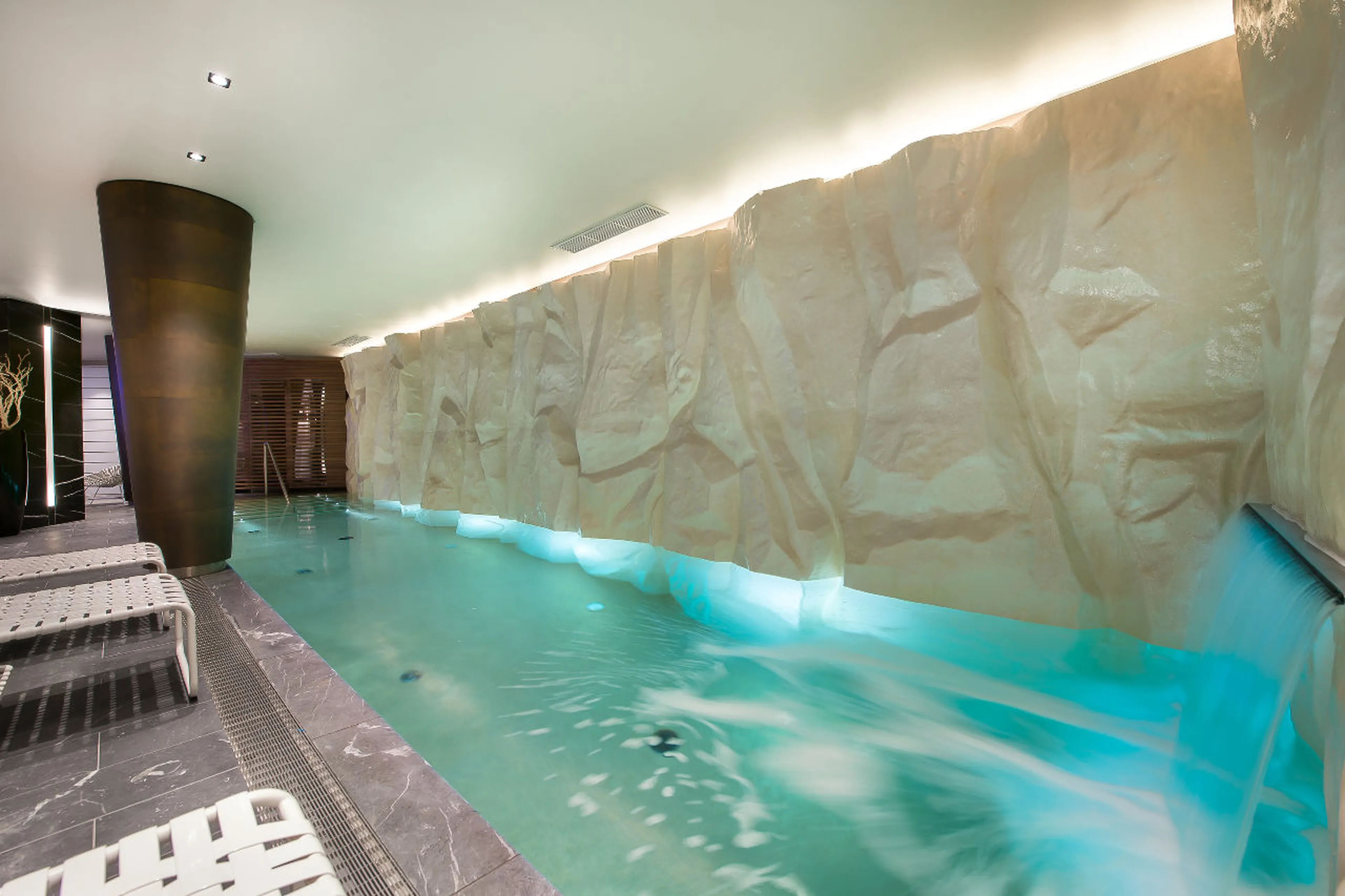 Swimming pool with waterfall feature in La Datcha in Courchevel 1850