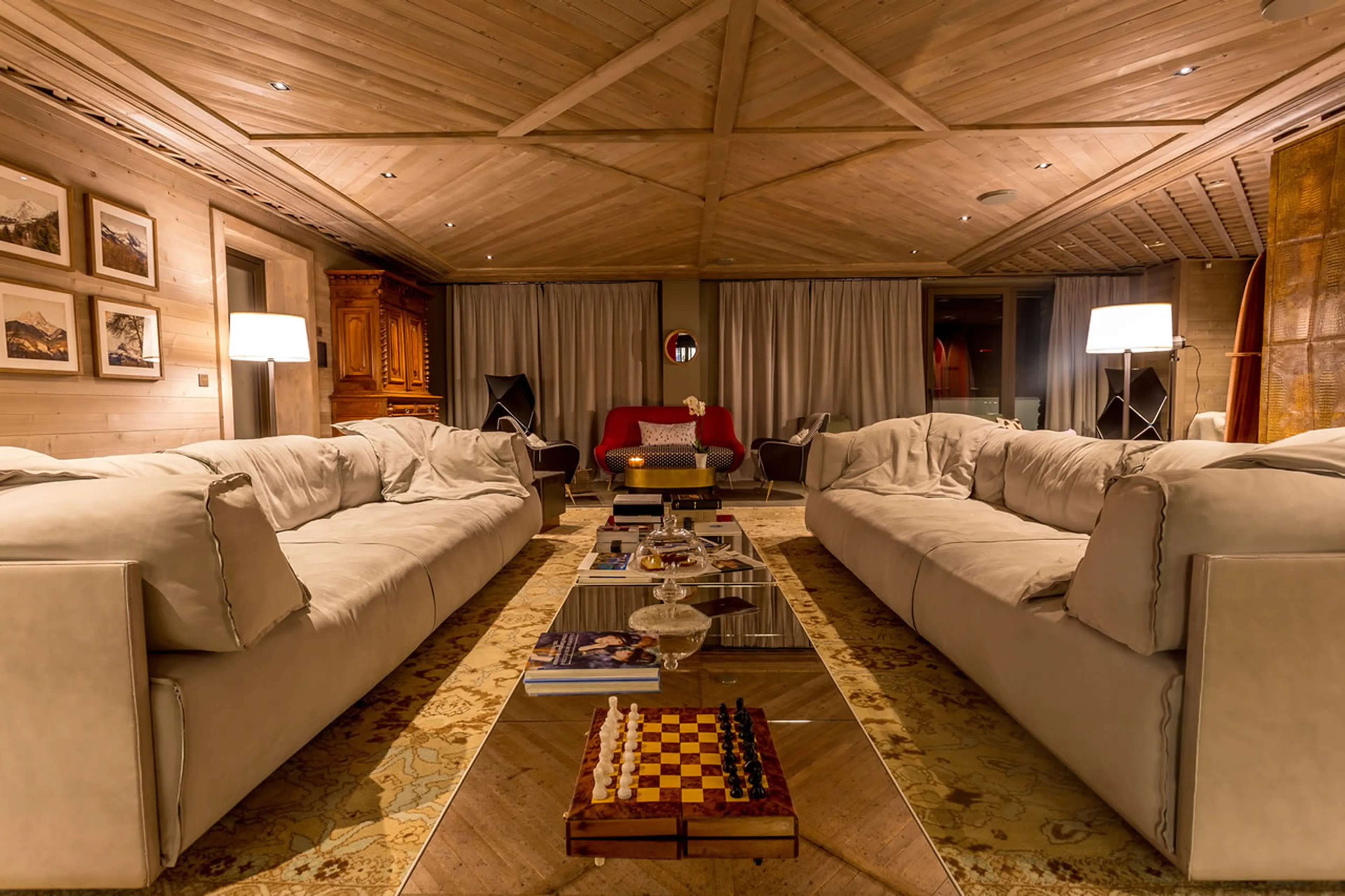 Expansive living room decorated in soft earthy colours in Chalet La Datcha in Val Thorens